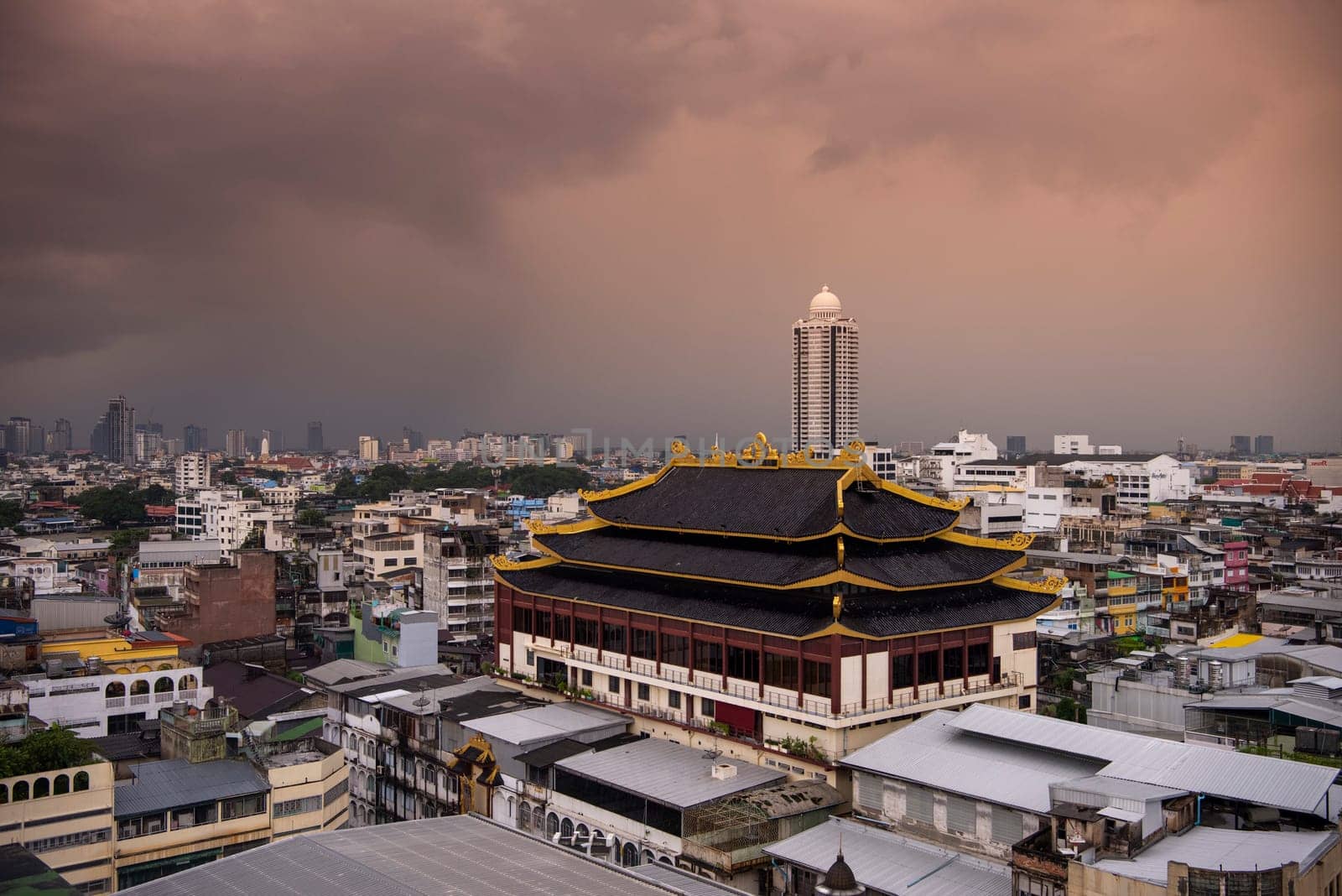 Wat Chaiyaphum Karam in China Town with skyline of City of Bangkok in Thailand.  Thailand, Bangkok, November, 5, 2024.
