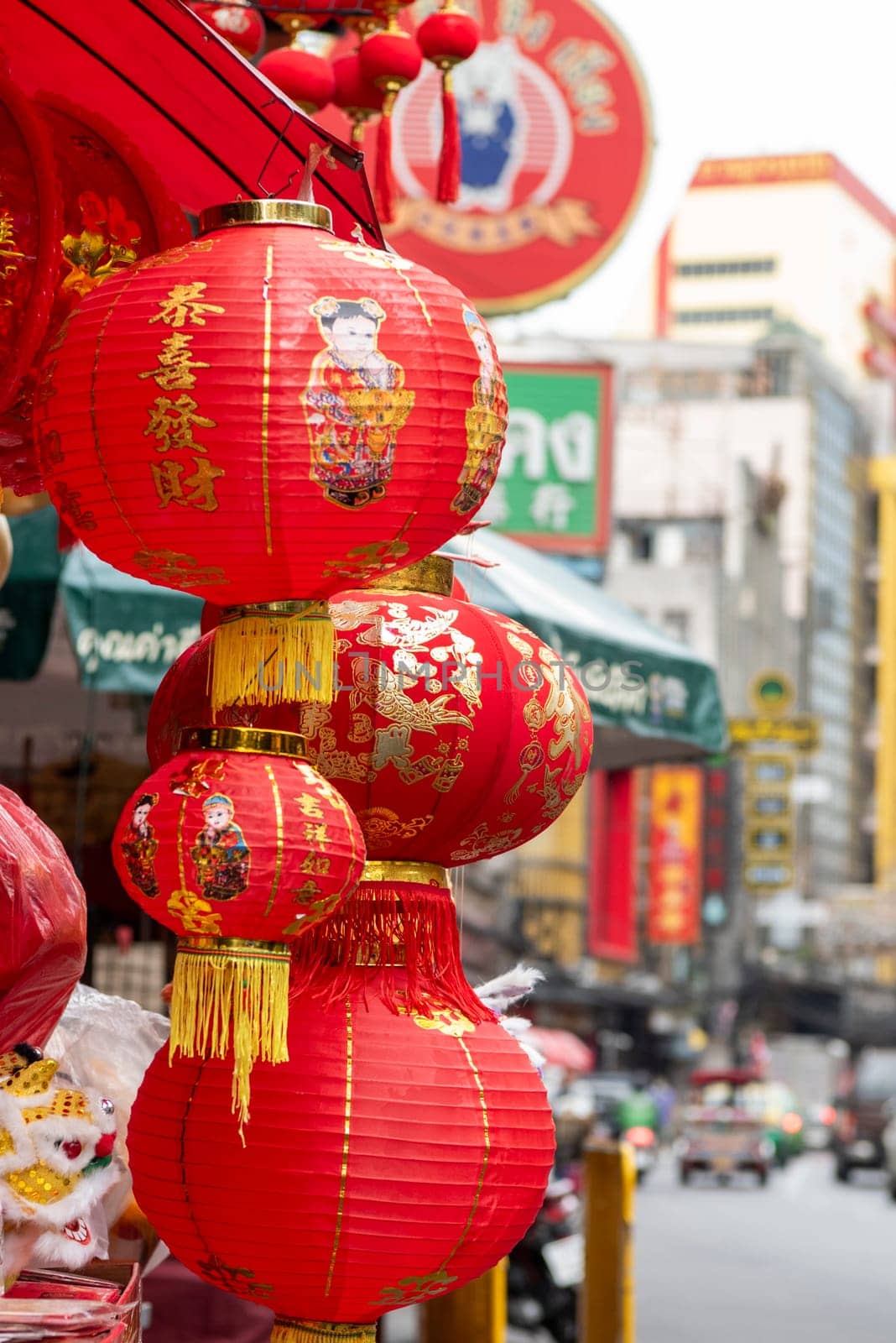 a Market street with shops in the China Town with skyline in the City of Bangkok in Thailand.  Thailand, Bangkok, November, 6, 2024.