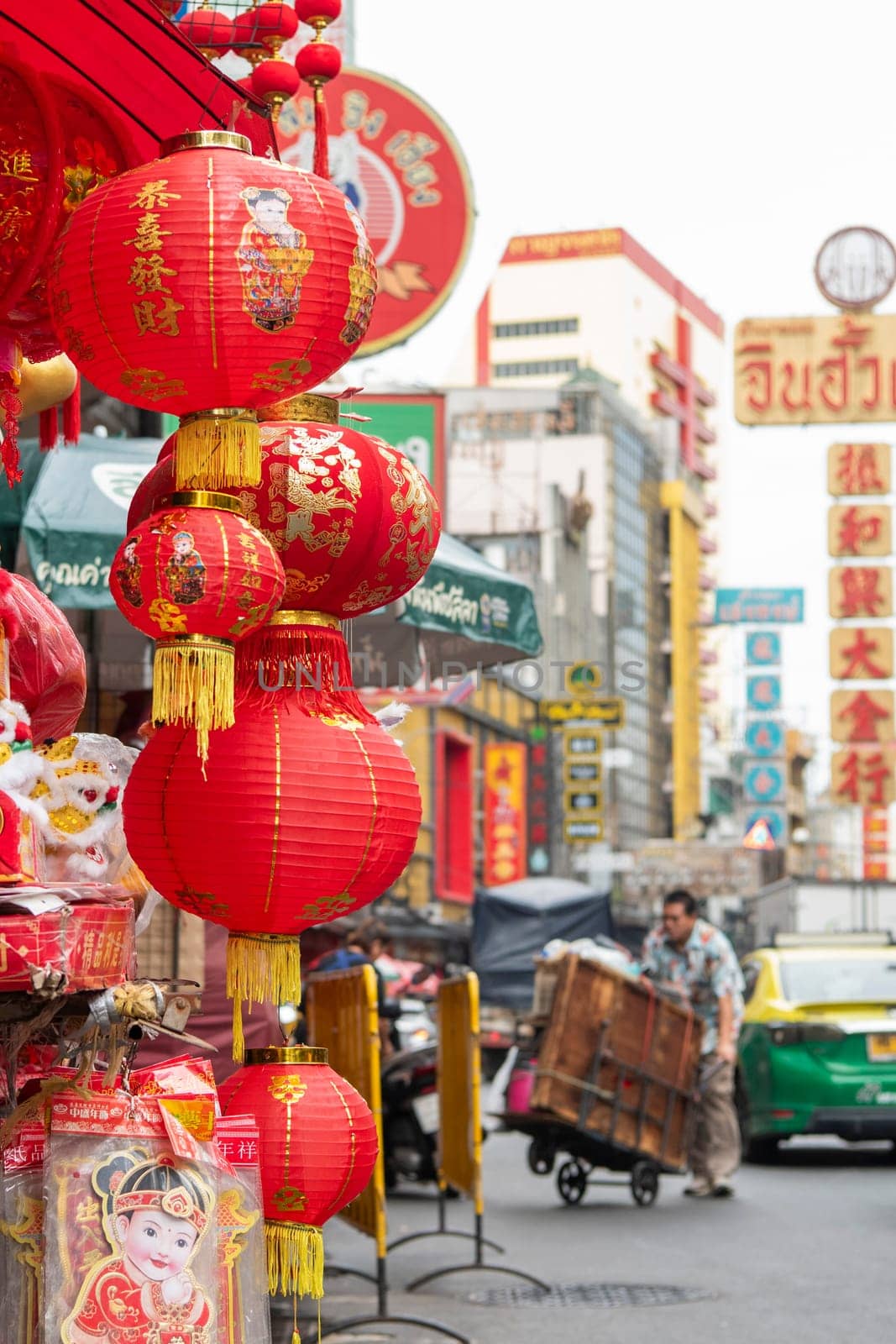 a Market street with shops in the China Town with skyline in the City of Bangkok in Thailand.  Thailand, Bangkok, November, 6, 2024.