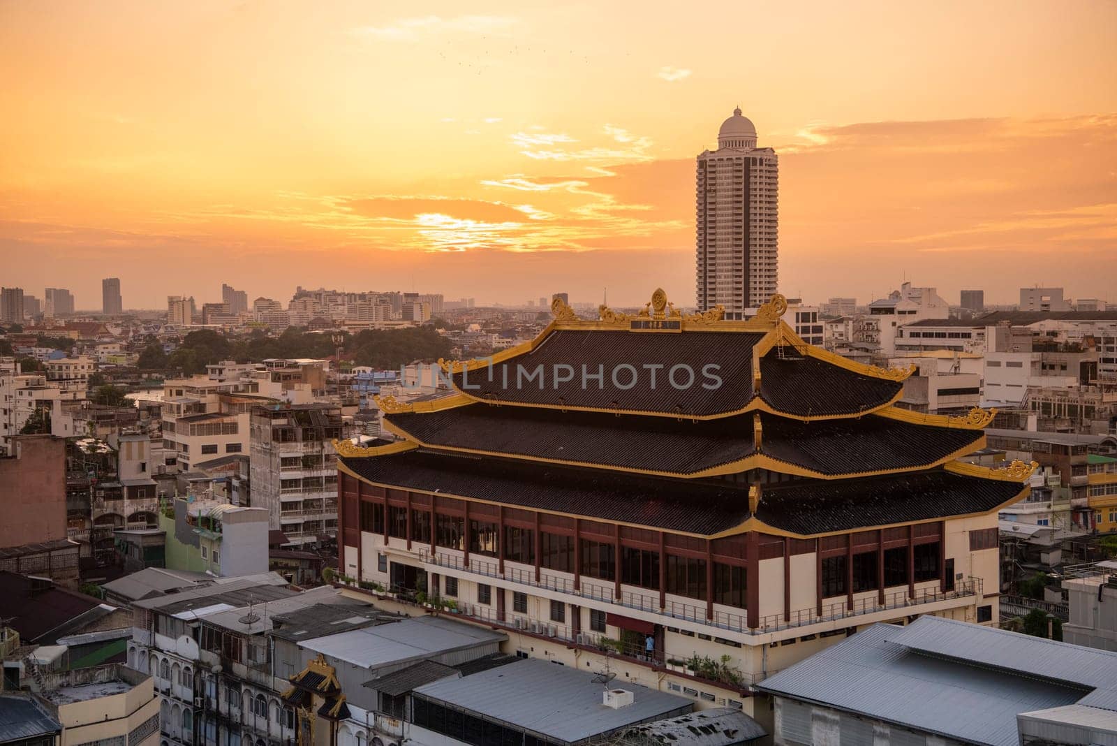 Wat Chaiyaphum Karam in China Town with skyline of City of Bangkok in Thailand.  Thailand, Bangkok, November, 6, 2024.