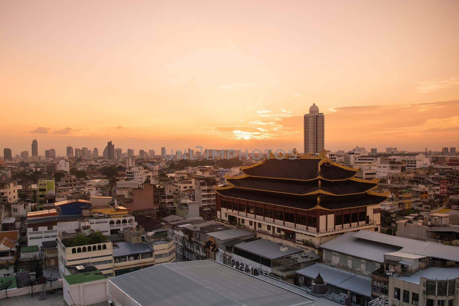 Wat Chaiyaphum Karam in China Town with skyline of City of Bangkok in Thailand.  Thailand, Bangkok, November, 6, 2024.