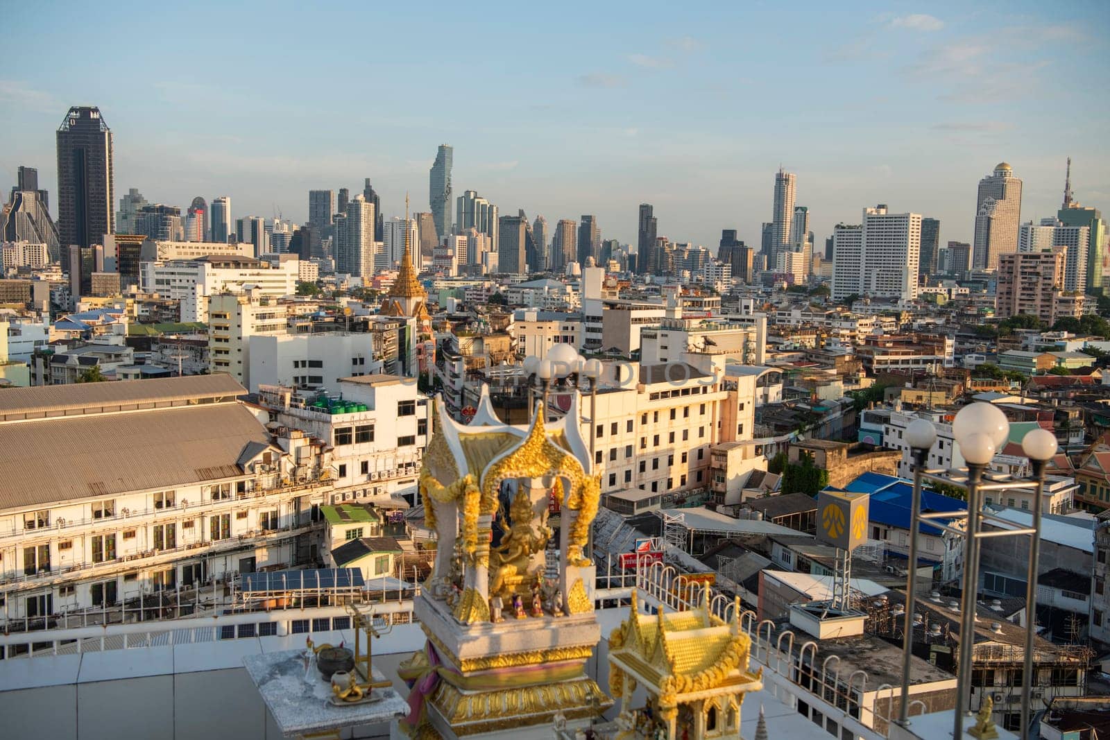 Wat Traimit in Chinatown with skyline in the City of Bangkok in Thailand.  Thailand, Bangkok, November, 6, 2024.