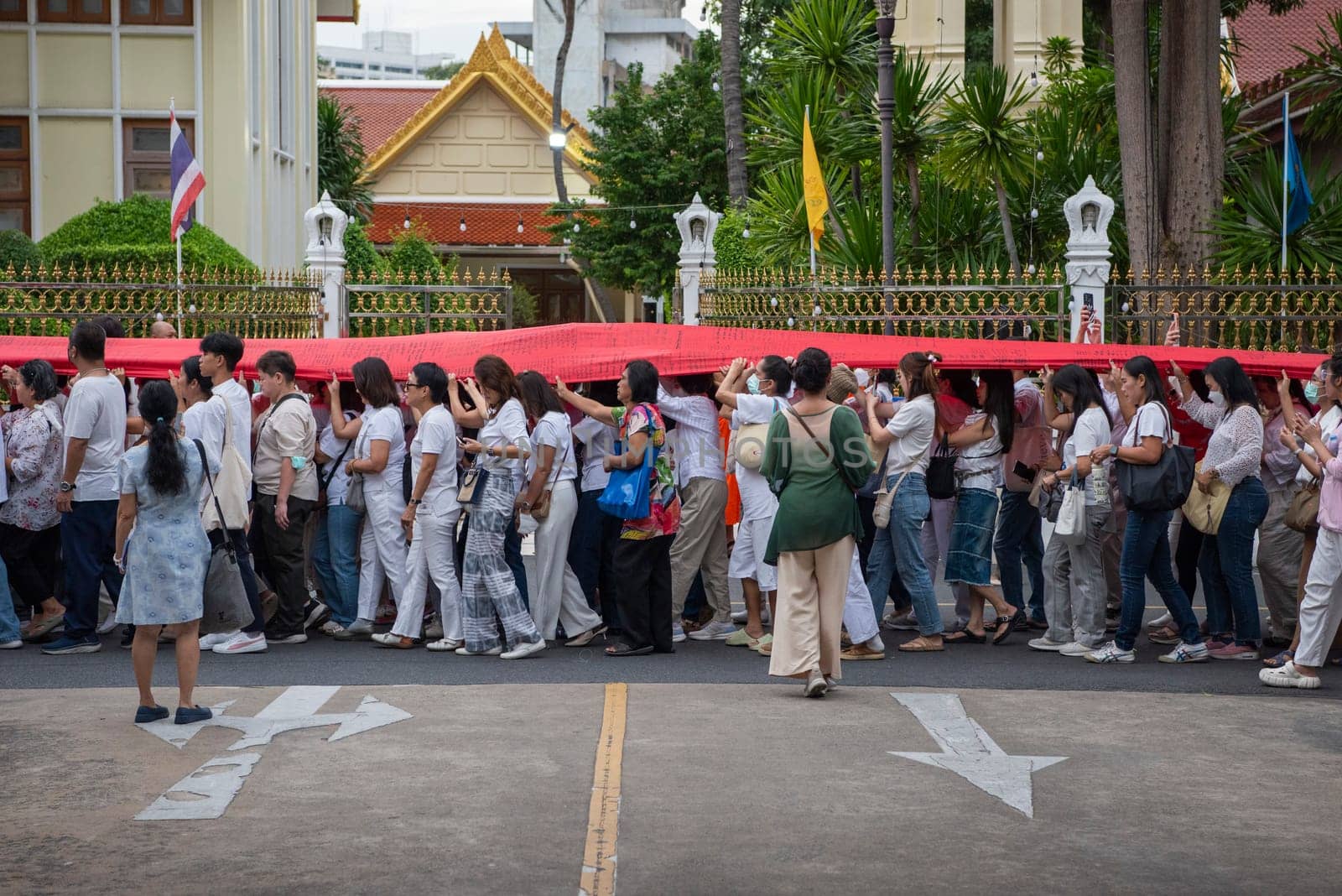 Ceremony on the way to Golden Mount at Wat Saket Festival Fair in Bangkok in Thailand.  Thailand, Bangkok, November, 8, 2024.