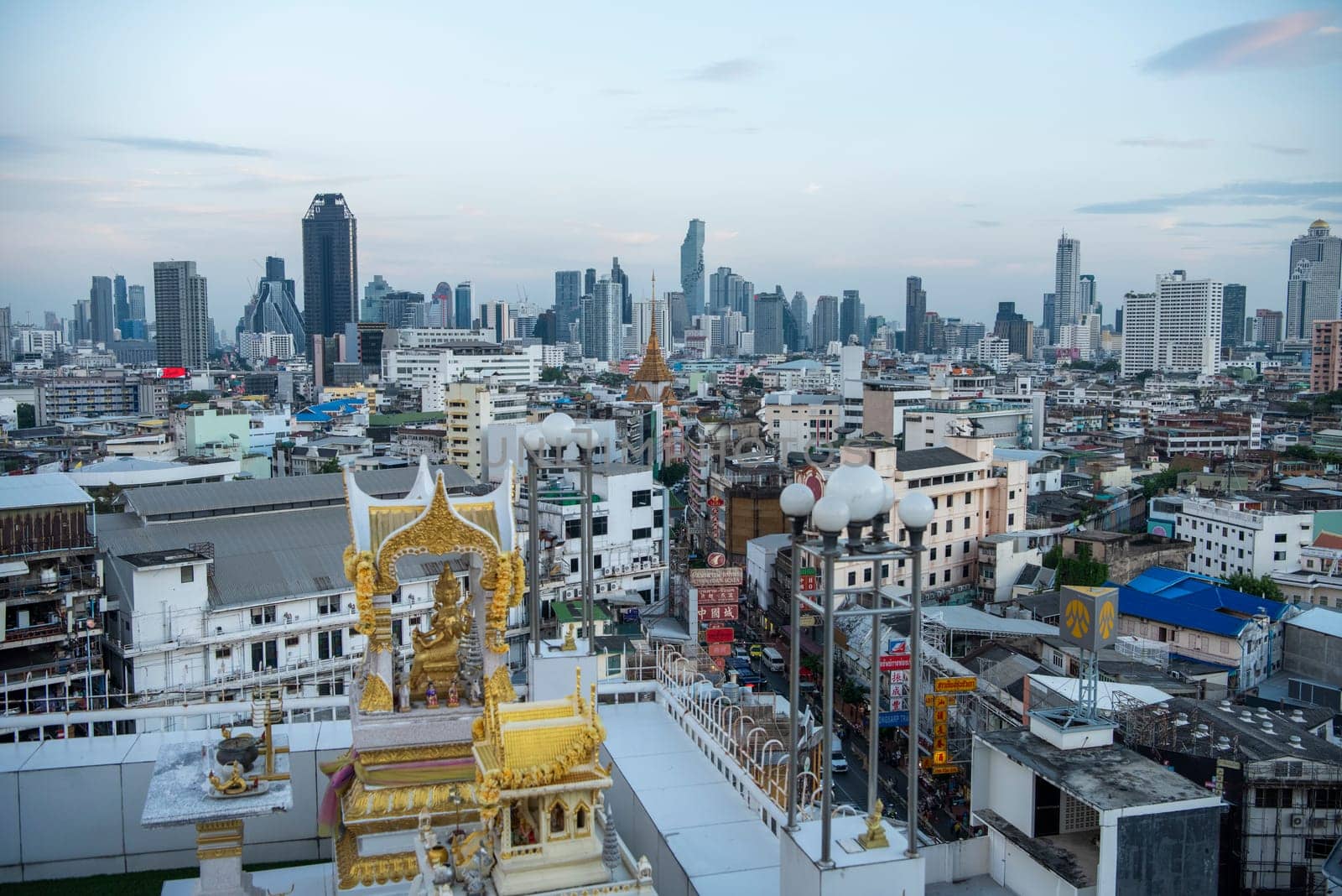 Wat Traimit in Chinatown with skyline in the City of Bangkok in Thailand.  Thailand, Bangkok, November, 6, 2024.