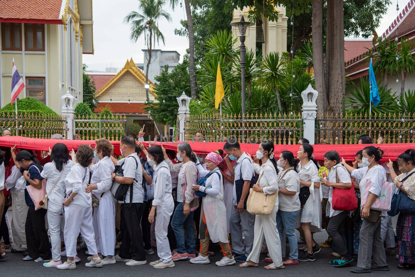 Ceremony on the way to Golden Mount at Wat Saket Festival Fair in Bangkok in Thailand.  Thailand, Bangkok, November, 8, 2024.