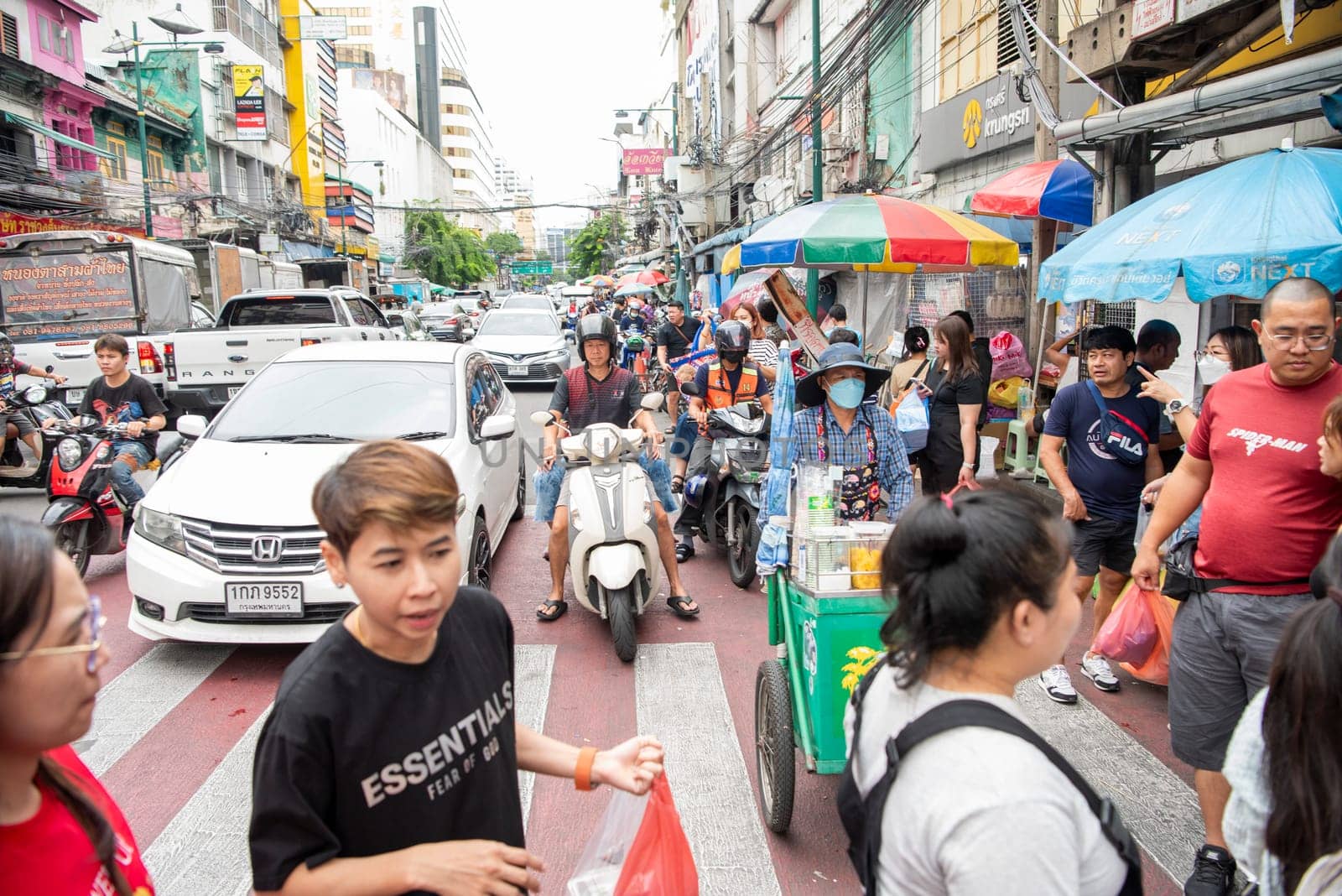 People and Traffic at Marketstreet on Yaowarat Road in Chinatown in City of Bangkok in Thailand.  Thailand, Bangkok, Dezember, 14, 2024.