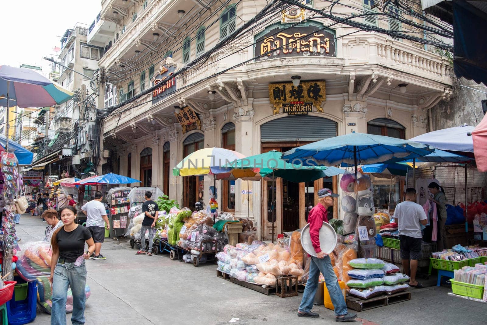 a street with shops and Market the China Town with skyline in the City of Bangkok in Thailand.  Thailand, Bangkok, November, 7, 2024.