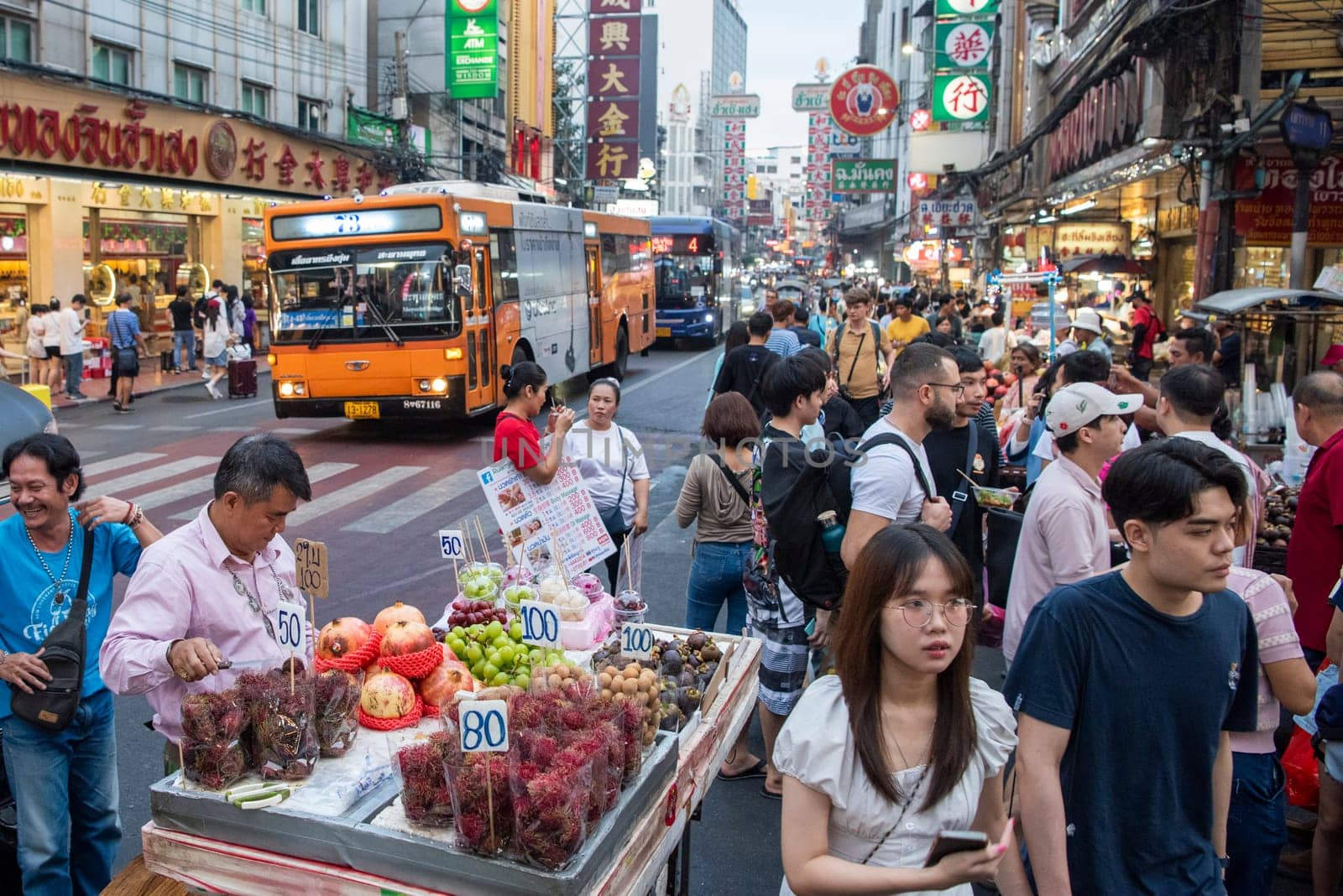 People and shops at Night Streetmarket on Yaowarat Road in Chinatown in City of Bangkok in Thailand.  Thailand, Bangkok, December,14, 2024.