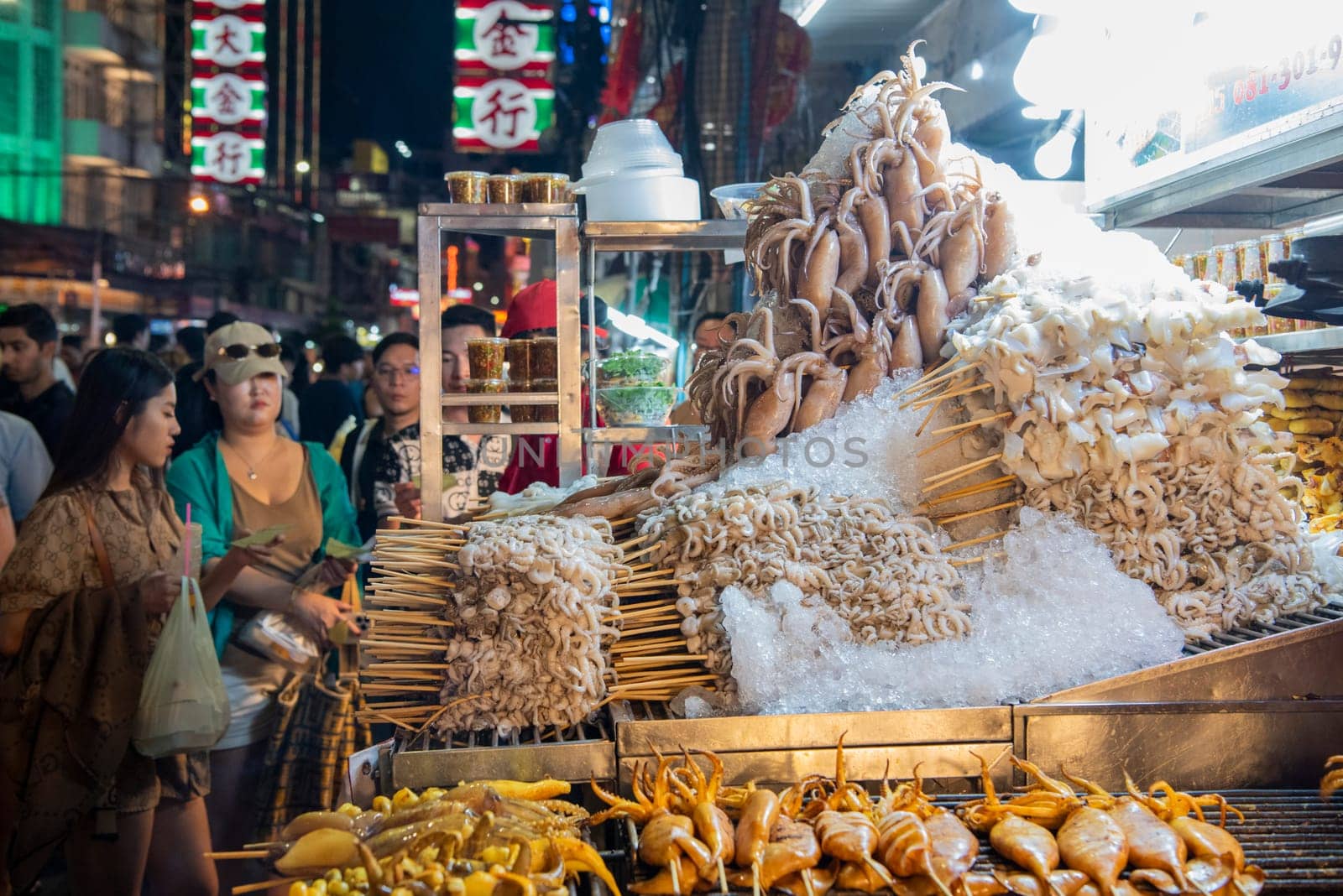 Seafood shops at Night Streetmarket on Yaowarat Road in Chinatown in City of Bangkok in Thailand.  Thailand, Bangkok, December,14, 2024.