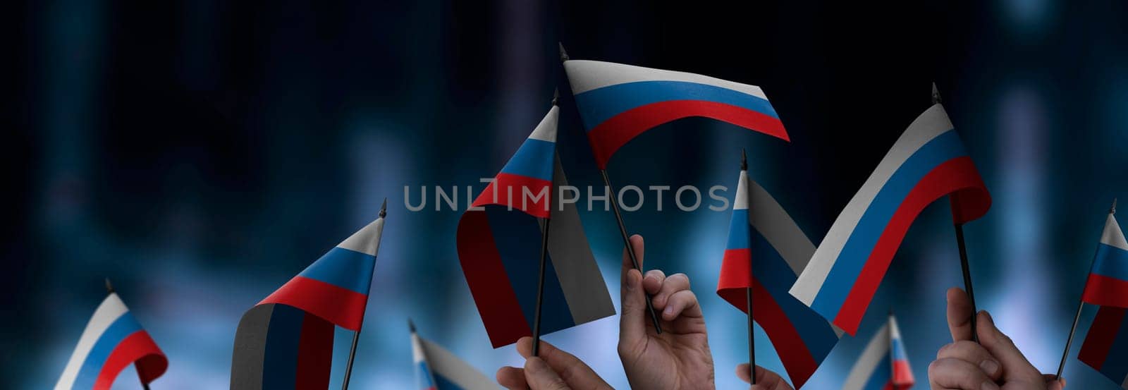 Russia flags in their hands on a blurred urban background. The photo illustration was created without the use of artificial intelligence, only using Photoshop.