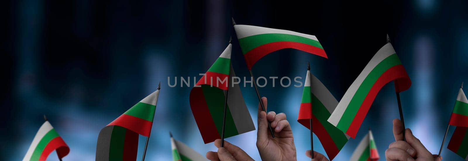 Bulgaria flags in their hands on a blurred urban background. The photo illustration was created without the use of artificial intelligence, only using Photoshop.