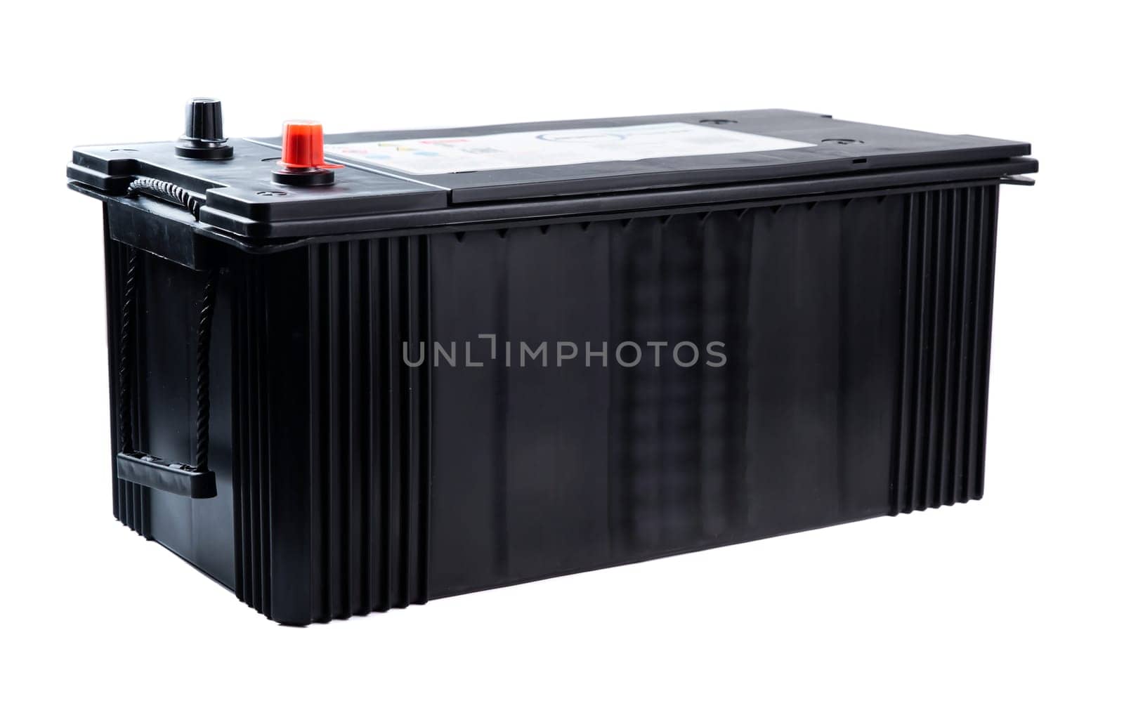 Single wide black truck battery with side handles for easy lifting. Heavy-duty power unit isolated on white background. Perfect for catalog or store.