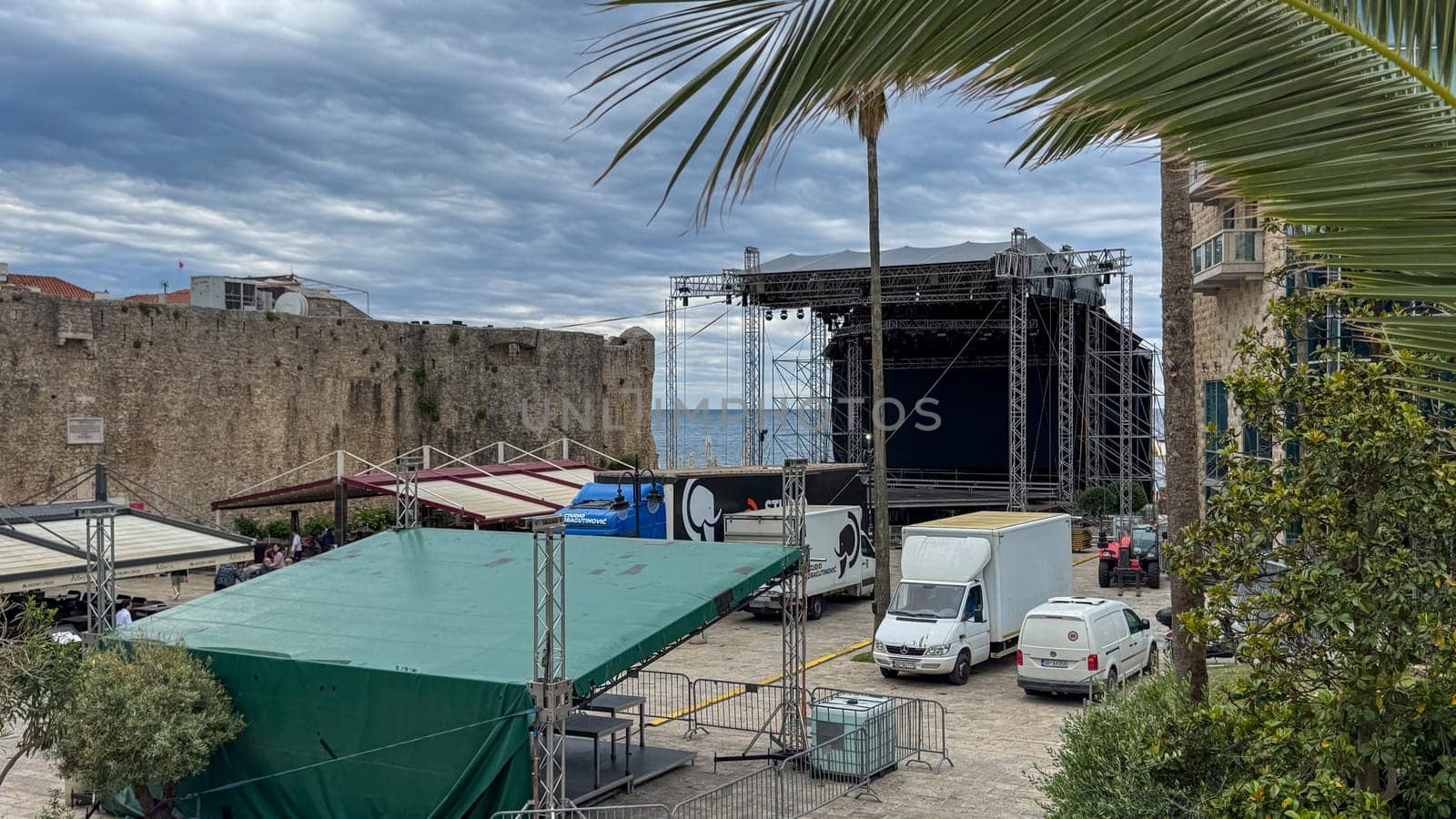 Budva, Montenegro - May 21, 2025: Stage preparation for summer tourist season opening ceremony with scenic backdrop and copy space
