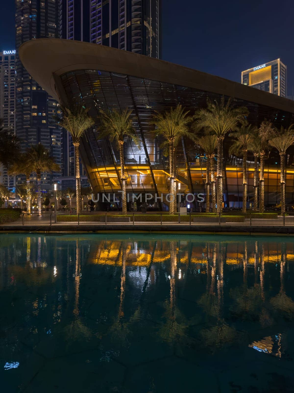 Dubai, UAE, 26 September 2024: Night view of the Dubai Opera near the Burj Khalifa Tower at night. High quality photo
