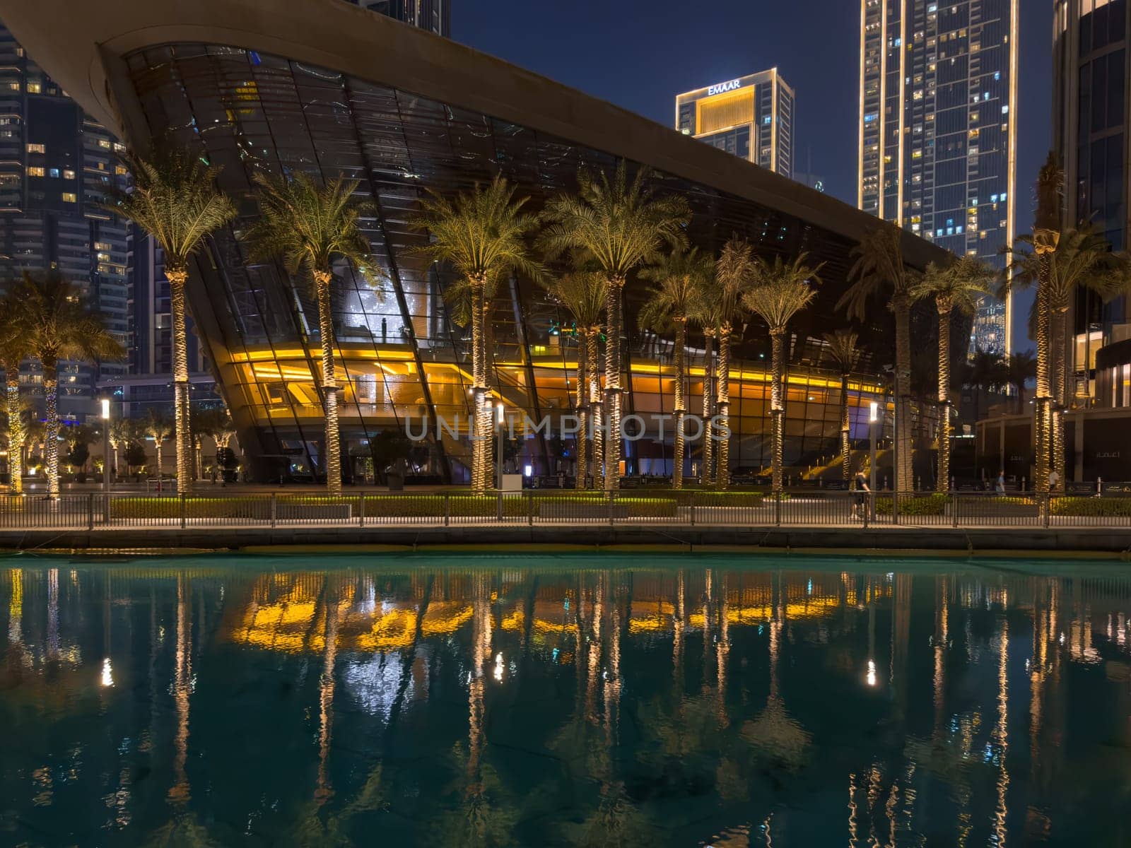 Dubai, UAE, 26 September 2024: Night view of the Dubai Opera near the Burj Khalifa Tower at night. High quality photo