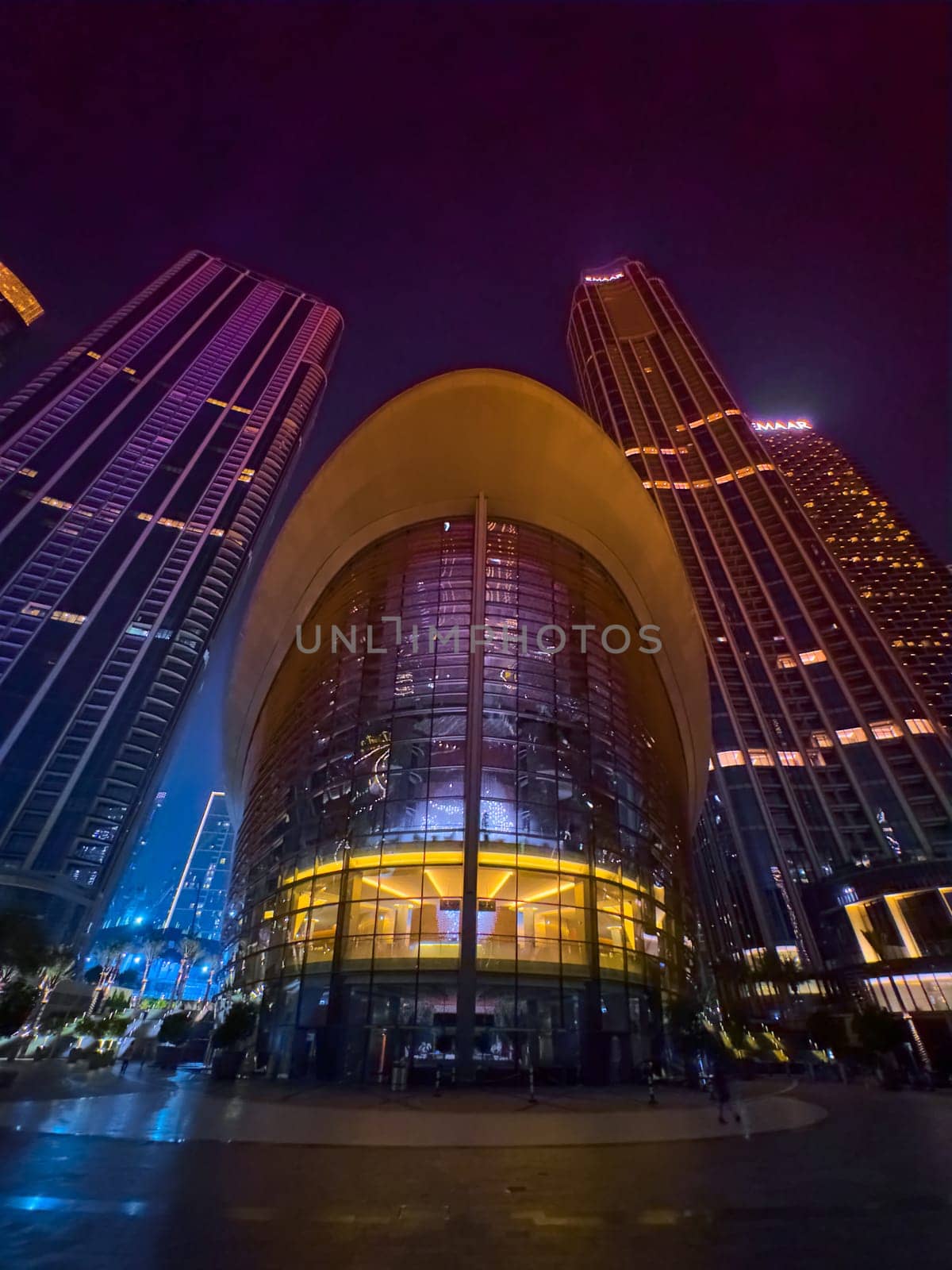 Dubai, UAE, 26 September 2024: Night view of the Dubai Opera near the Burj Khalifa Tower at night. High quality photo