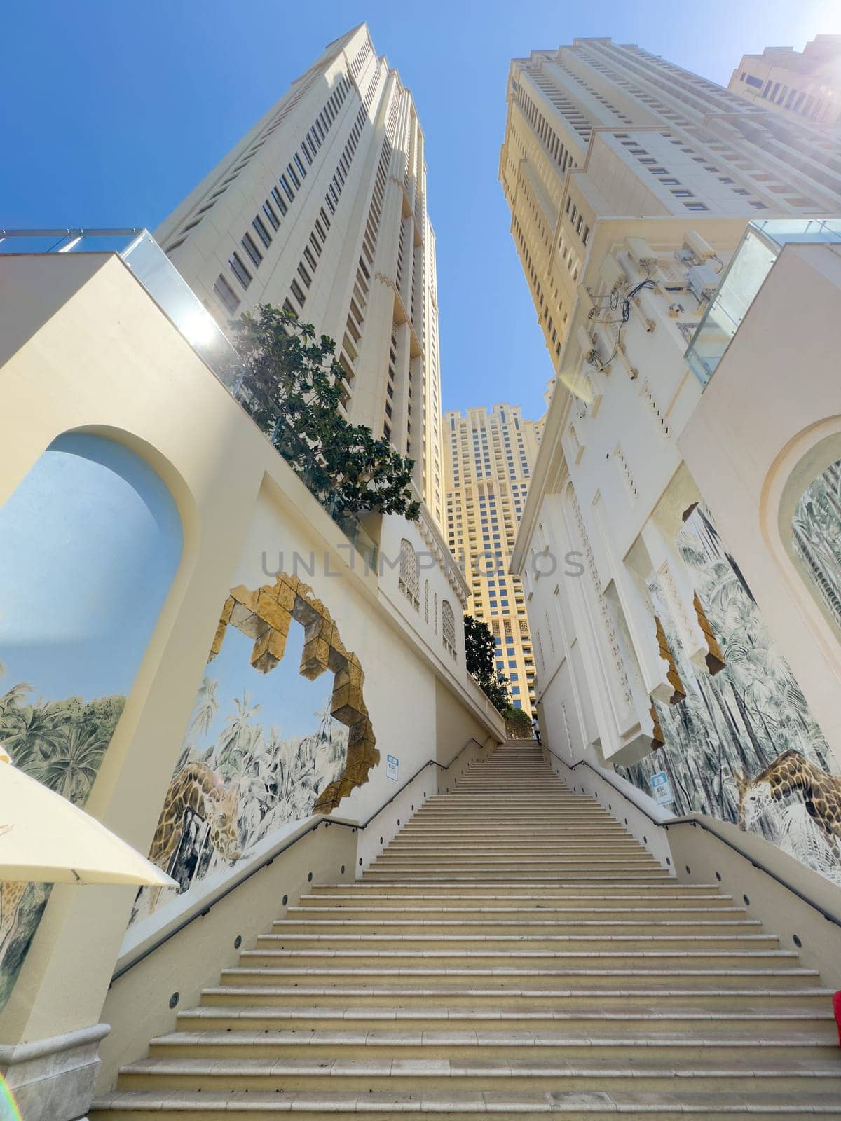 UAE, Dubai, 19 September 2024: architecture of the city at sunset, skyscrapers with glass facades. High quality photo