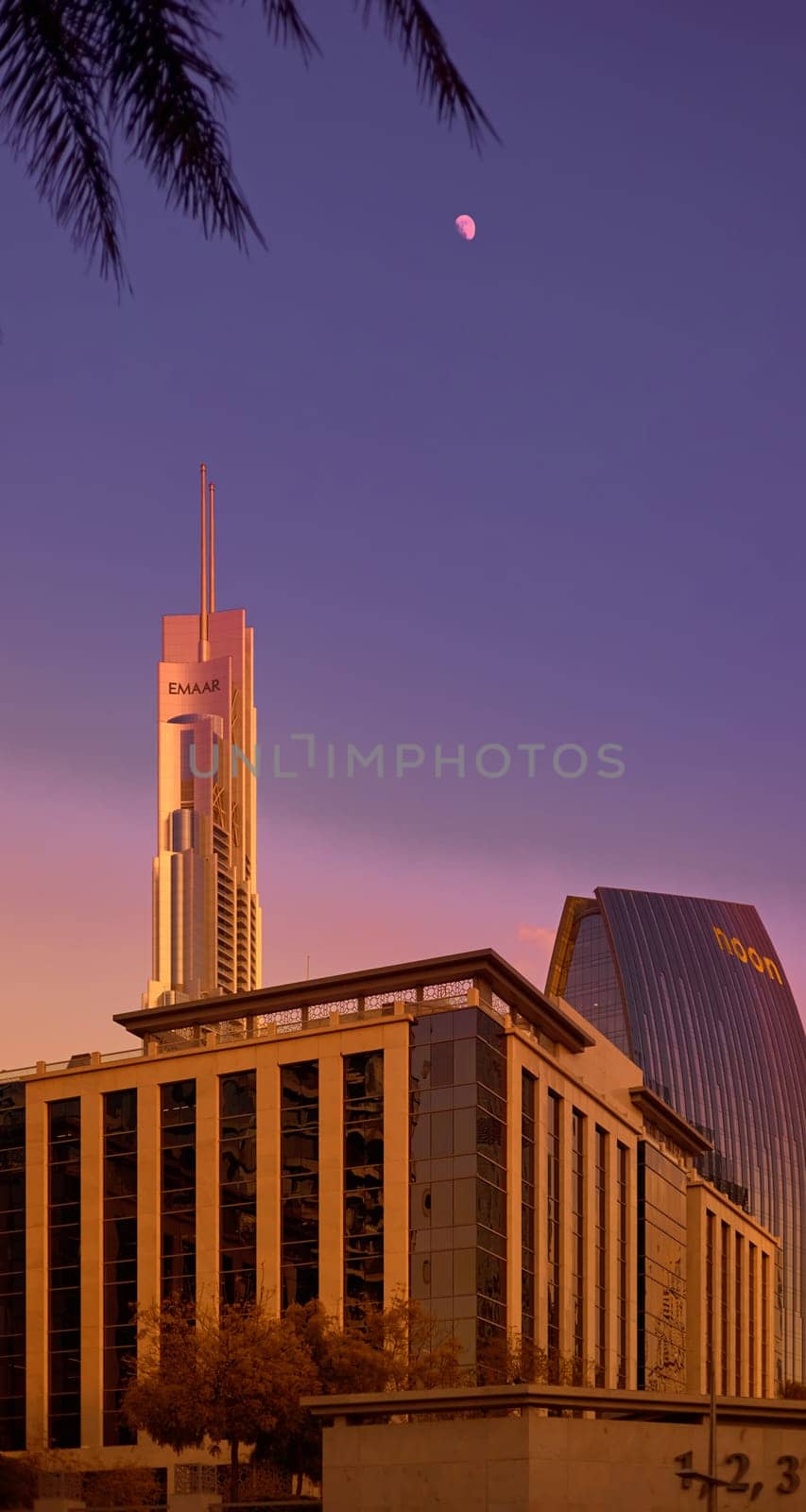 UAE, Dubai, 19 September 2024: architecture of the city at sunset, skyscrapers with glass facades. High quality photo