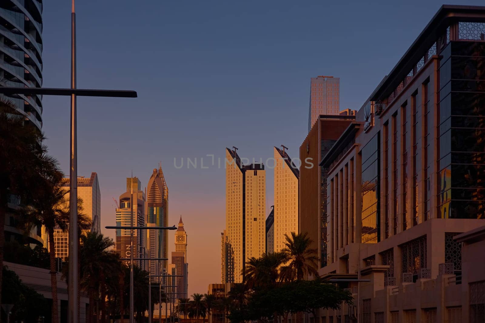 UAE, Dubai, 19 September 2024: architecture of the city at sunset, skyscrapers with glass facades. High quality photo