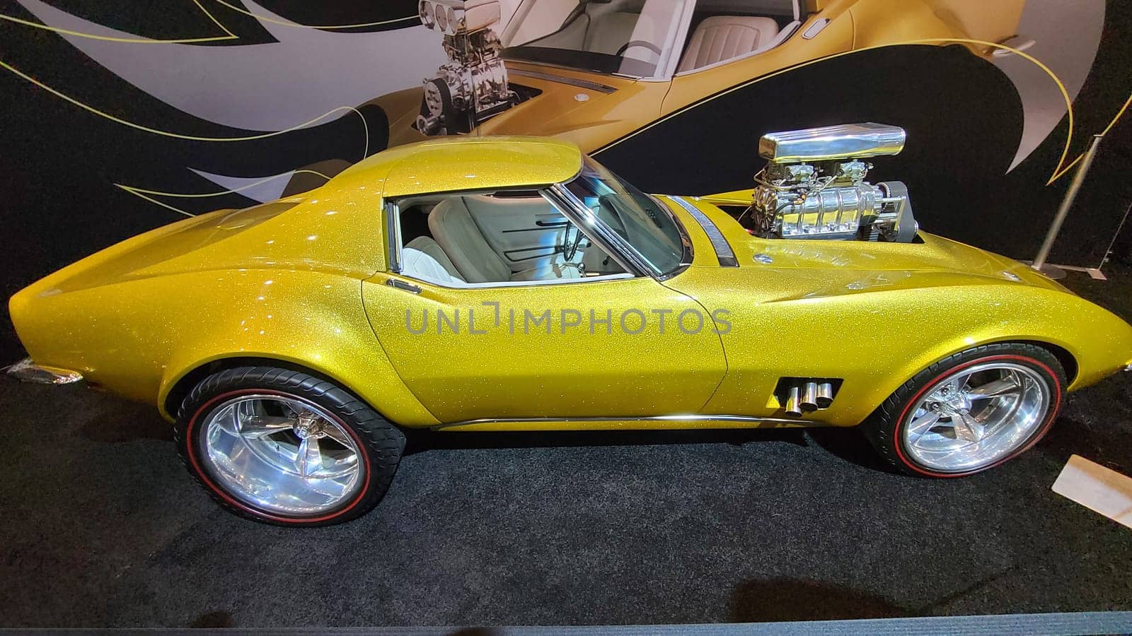 Toronto, ON Canada - 02.19.2023: Eye-Catching Yellow Custom Car on Display, Automotive Elegance and Classic Vehicle Design.