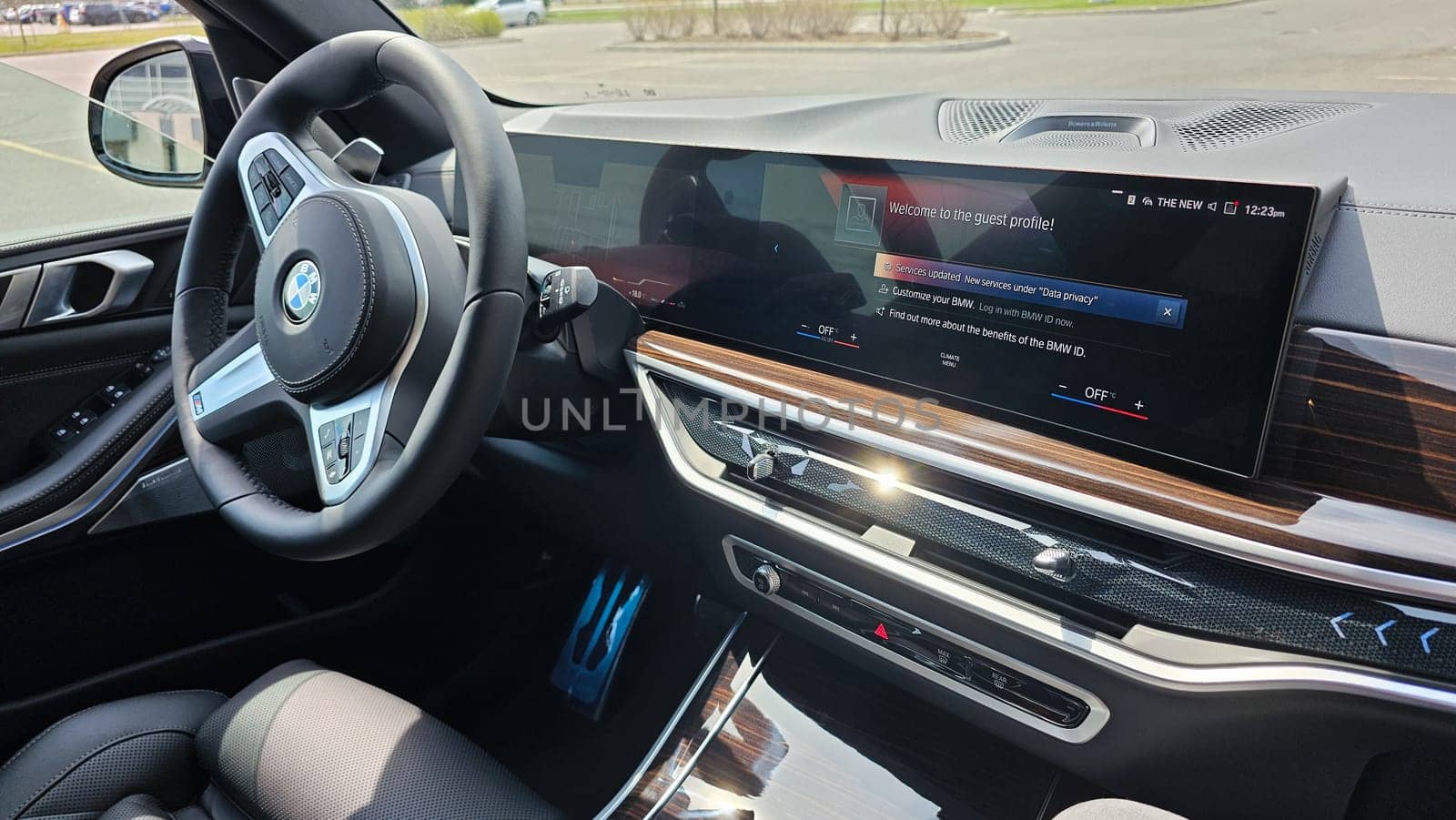 Ottawa, ON Canada - 04.22.2023: Interior View of a Luxury BMW X5 Car s Dashboard with a Large Infotainment Screen Displaying Car Settings.