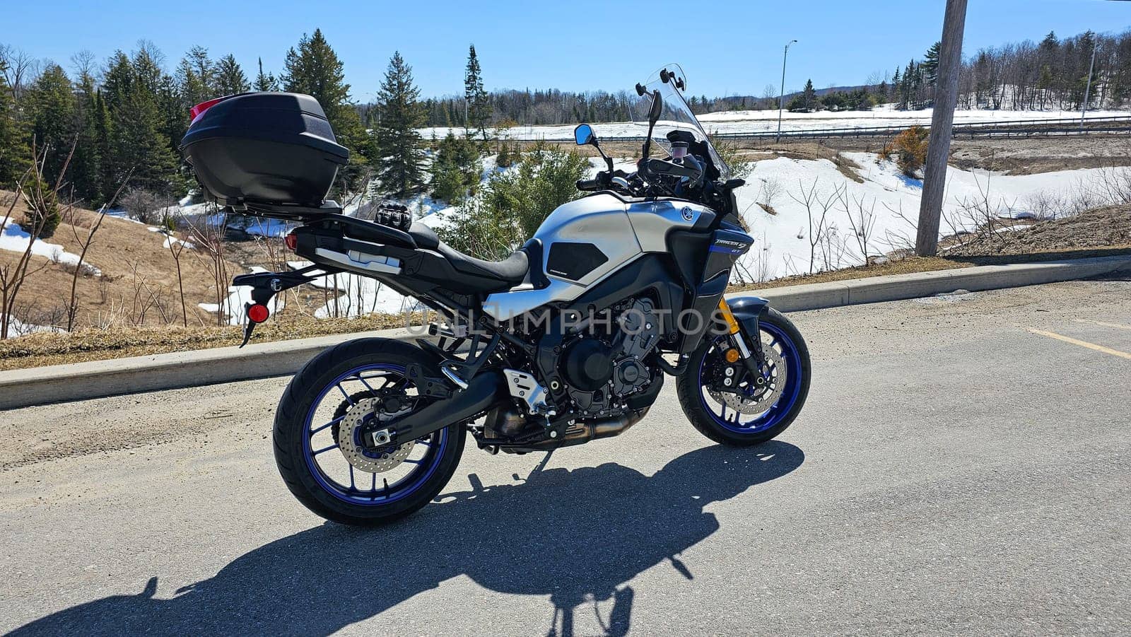 Ottawa, ON Canada - 04.09.2023: Touring Machine A Modern Adventure Yamaha Tracer 9 GT Motorcycle Ready for the Open Road. Gray Asphalt.
