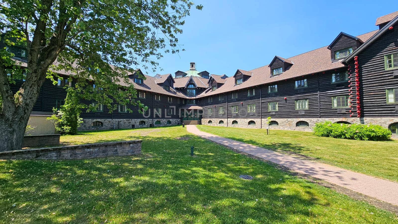 Ottawa, ON Canada - 06.04.2023: Grand Lodge Exterior with Lush Green Lawn and Pathway on a Sunny Day, Architectural Splendor.