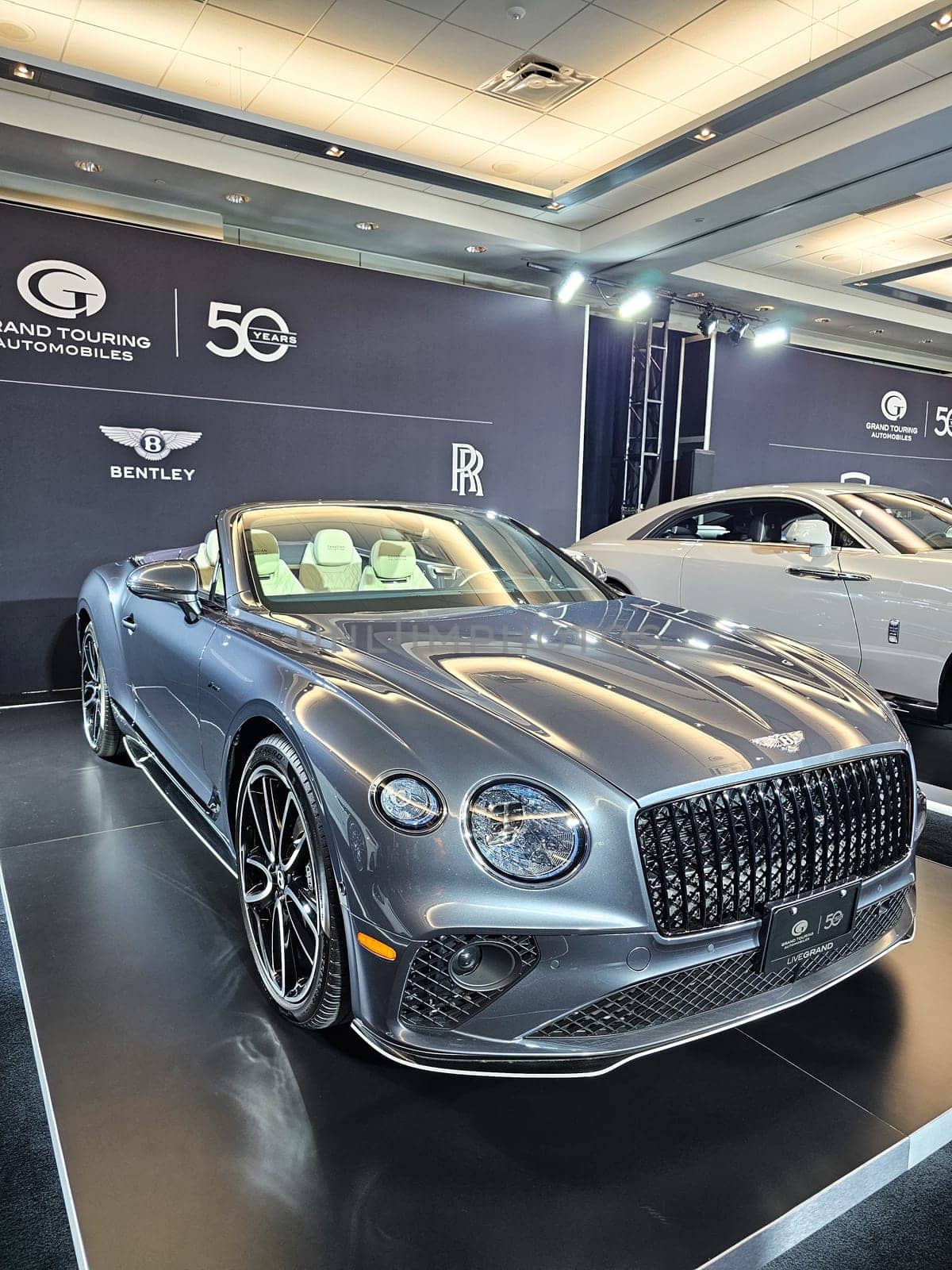 Toronto, ON Canada - 02.23.2024: Elegant Convertible Bentley Car Displayed at Automotive Exhibition, Showcasing Luxury Design and Style.