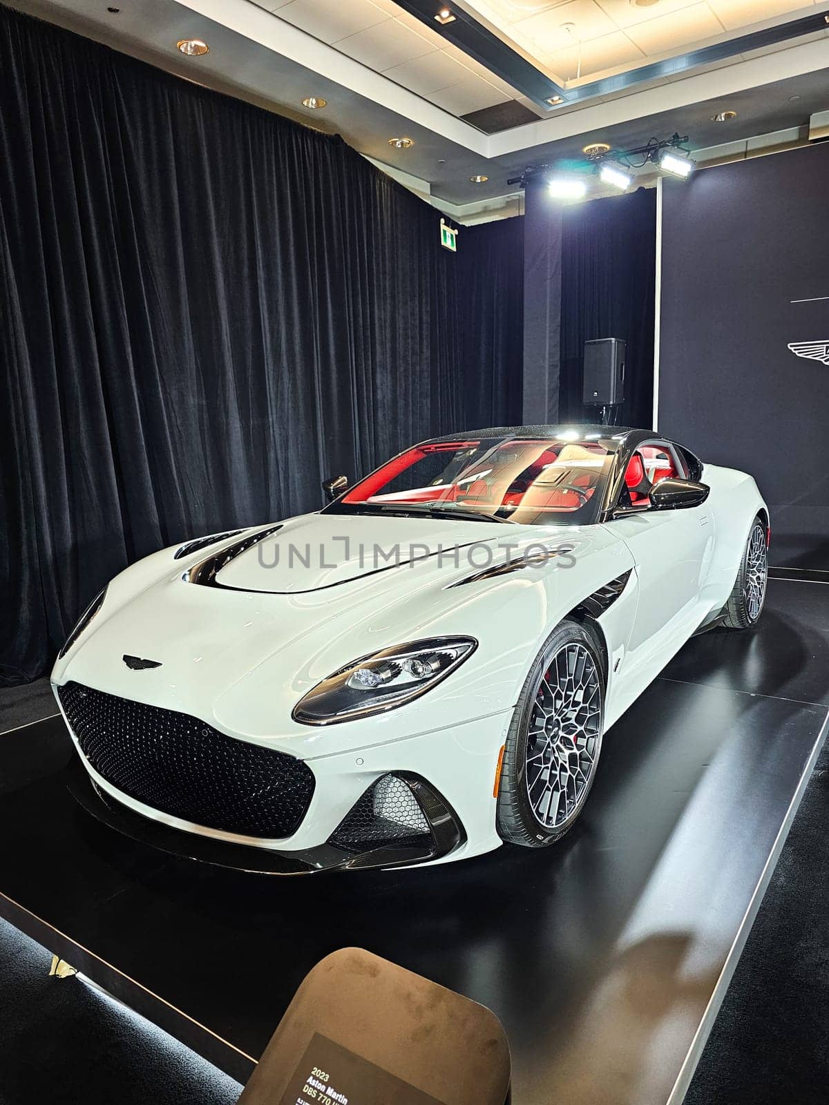 Toronto, ON Canada - 02.23.2024: Elegant White Sports Car Displayed at an Exhibition with Sleek Design and Modern Features.
