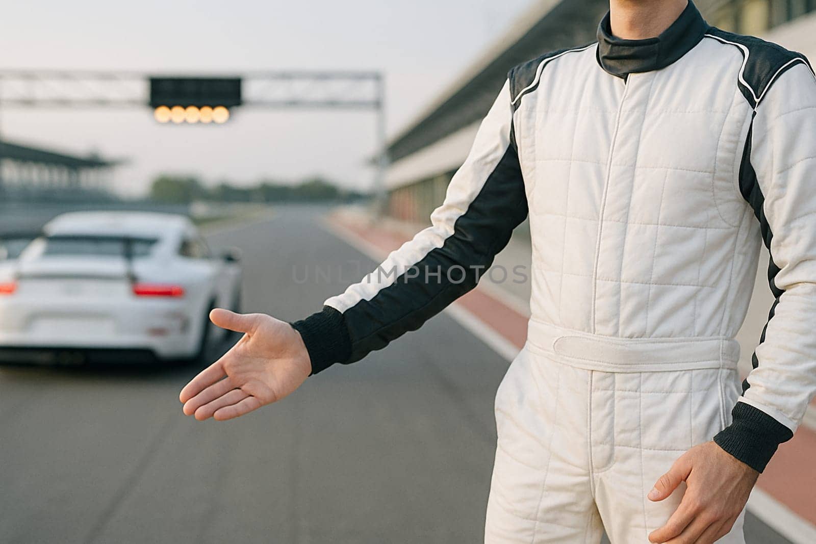 AI generated A determined race car driver stands at the edge of the frame, gesturing toward a high-speed racetrack filled with roaring cars. The dynamic scene captures adrenaline, competition