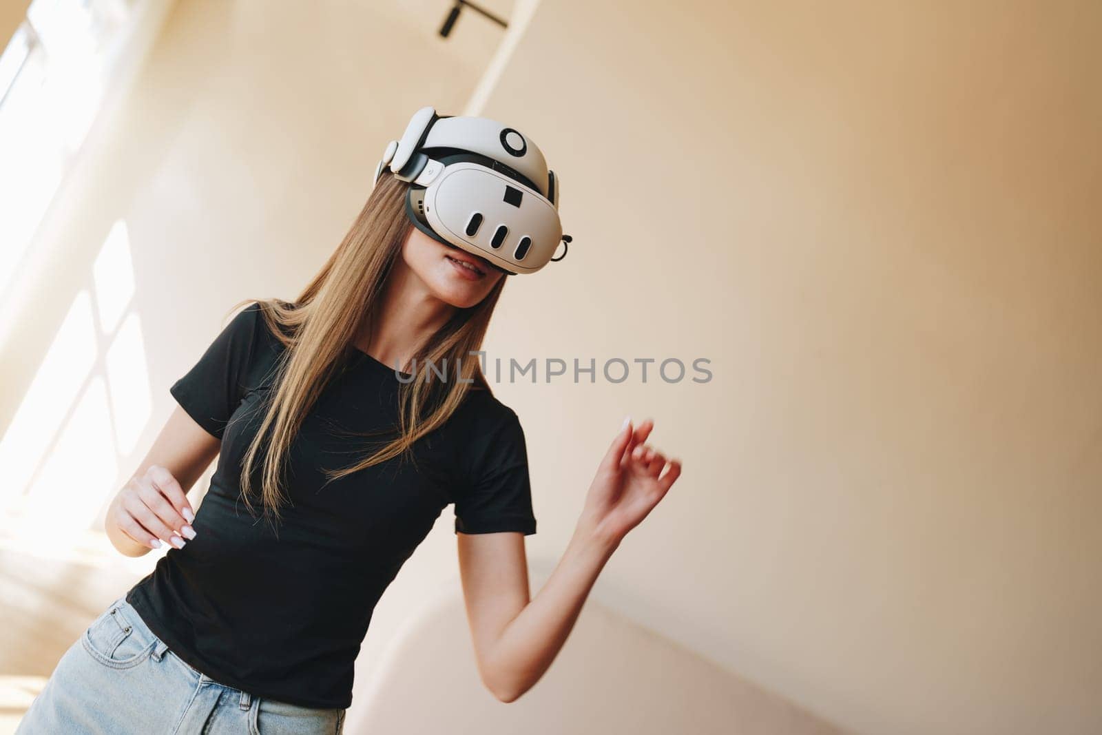 A young woman engages in a virtual reality activity, wearing a VR headset in a bright indoor location. She appears focused and immersed in her experience, with soft lighting enhancing the atmosphere.