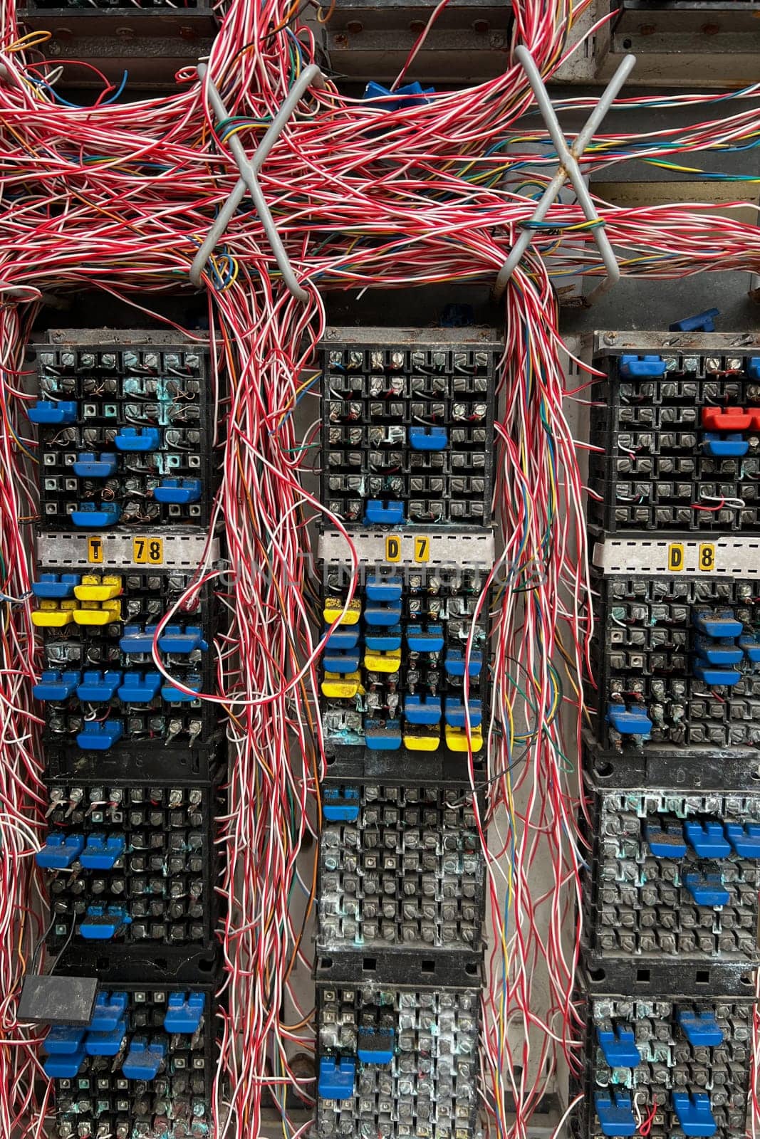 Fiber optical network cables panel. Old telephone cross connection box.