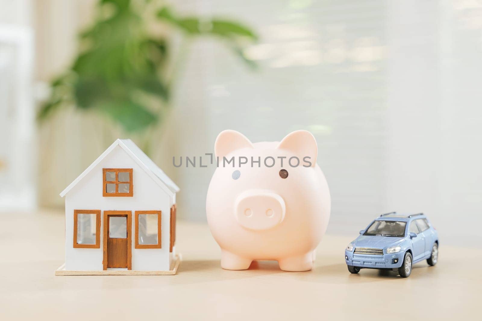 House and car models next to piggy bank signify saving for property and automobile ownership. Emphasizes investment strategies, financial planning, tax minimization for asset building expense control