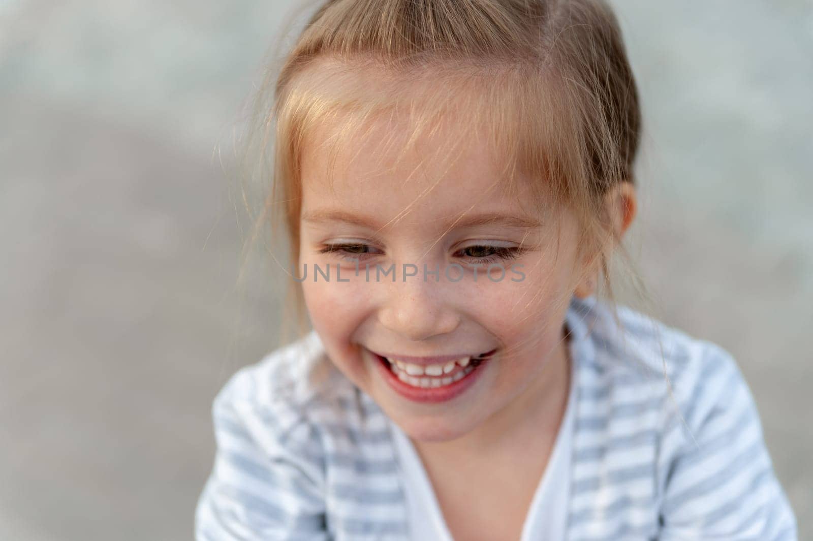 Girl Laughing In A Close-Up Portrait
