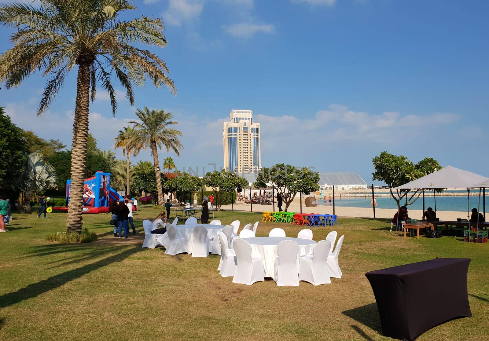 Doha, Qatar - Nov 22. 2019 . Festive tables and chairs on beach - getting ready for the celebration