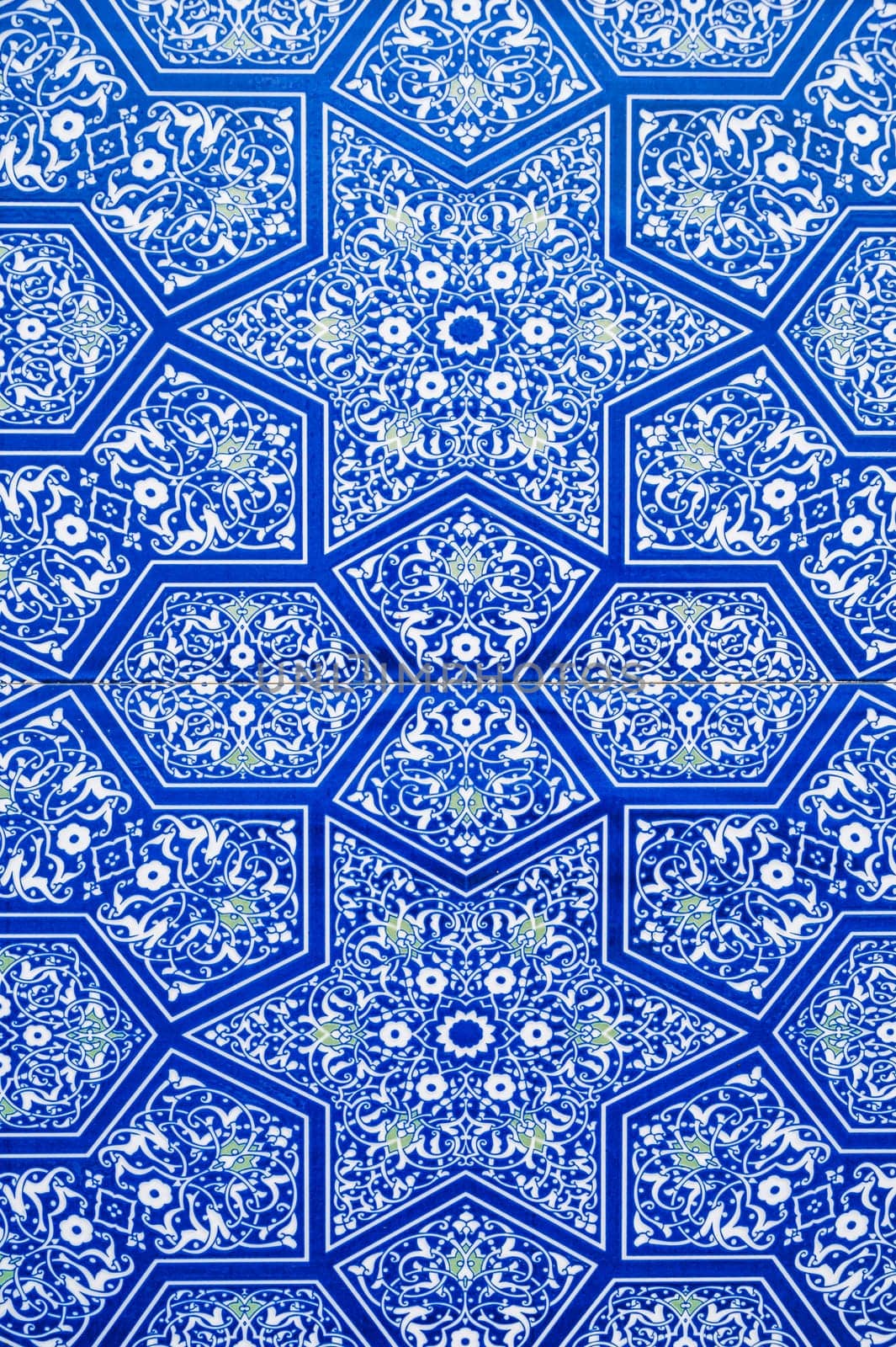 ceramic tiles with traditional Uzbek oriental pattern arabesque in Uzbekistan. Blue decorative geometric background with Islamic ornament