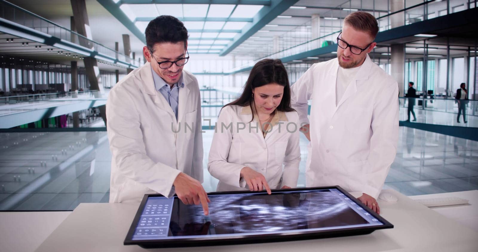 Medical Professionals Carefully Analyzing Ultrasound Scan Of Expecting Mother In Hospital.
