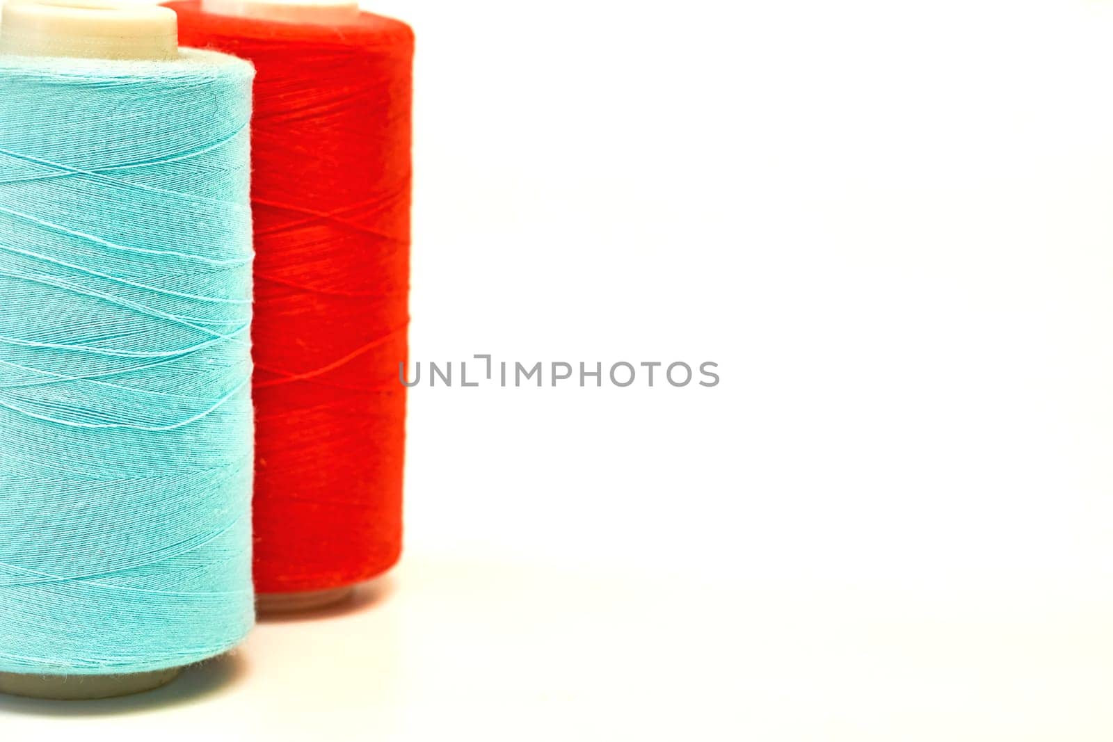 a cylindrical device on which film, magnetic tape, thread, or other flexible materials can be wound a reel.