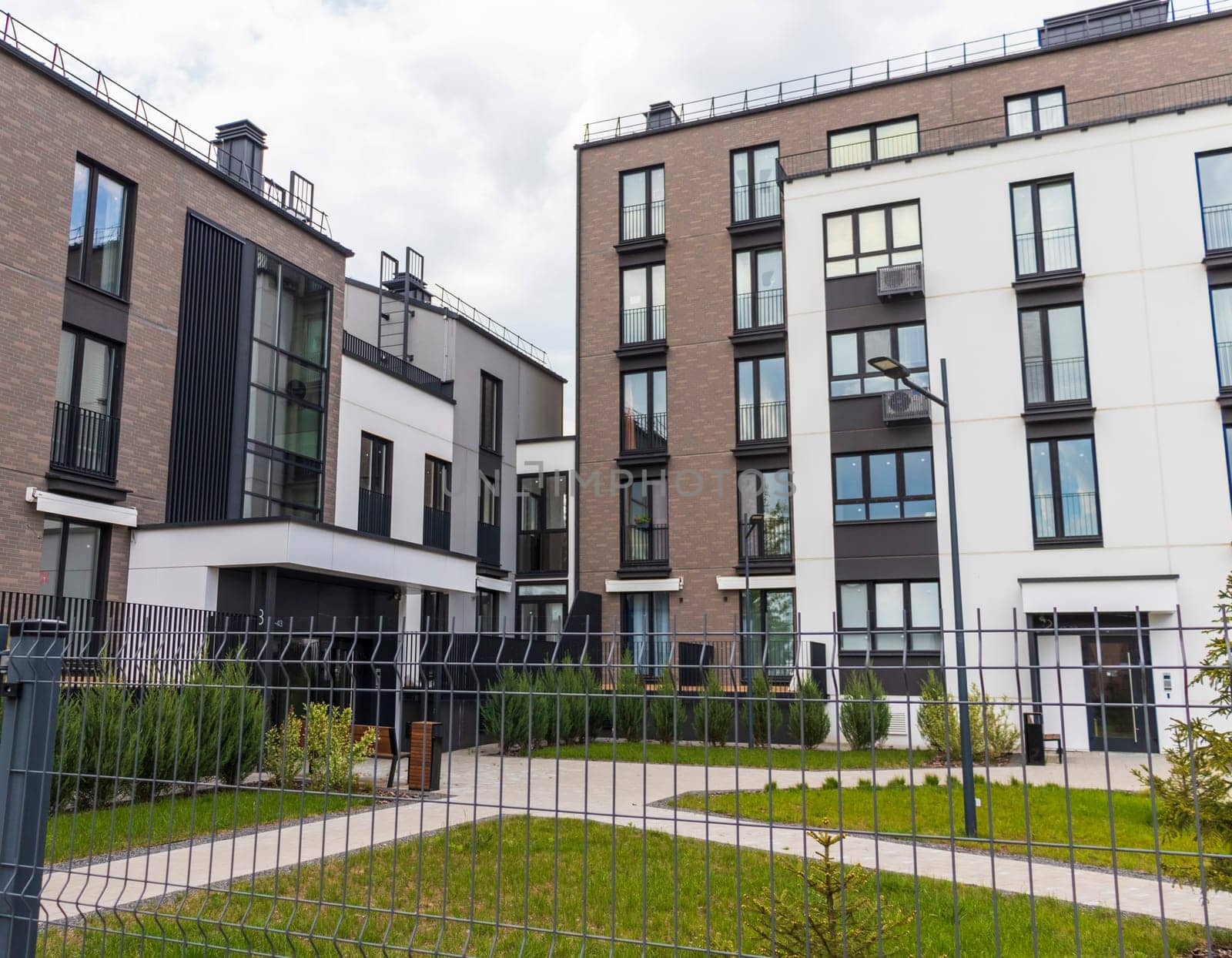 Shot of the stylish, modern, urban, residential suburb where buildings have ergonomic design and vivid colors