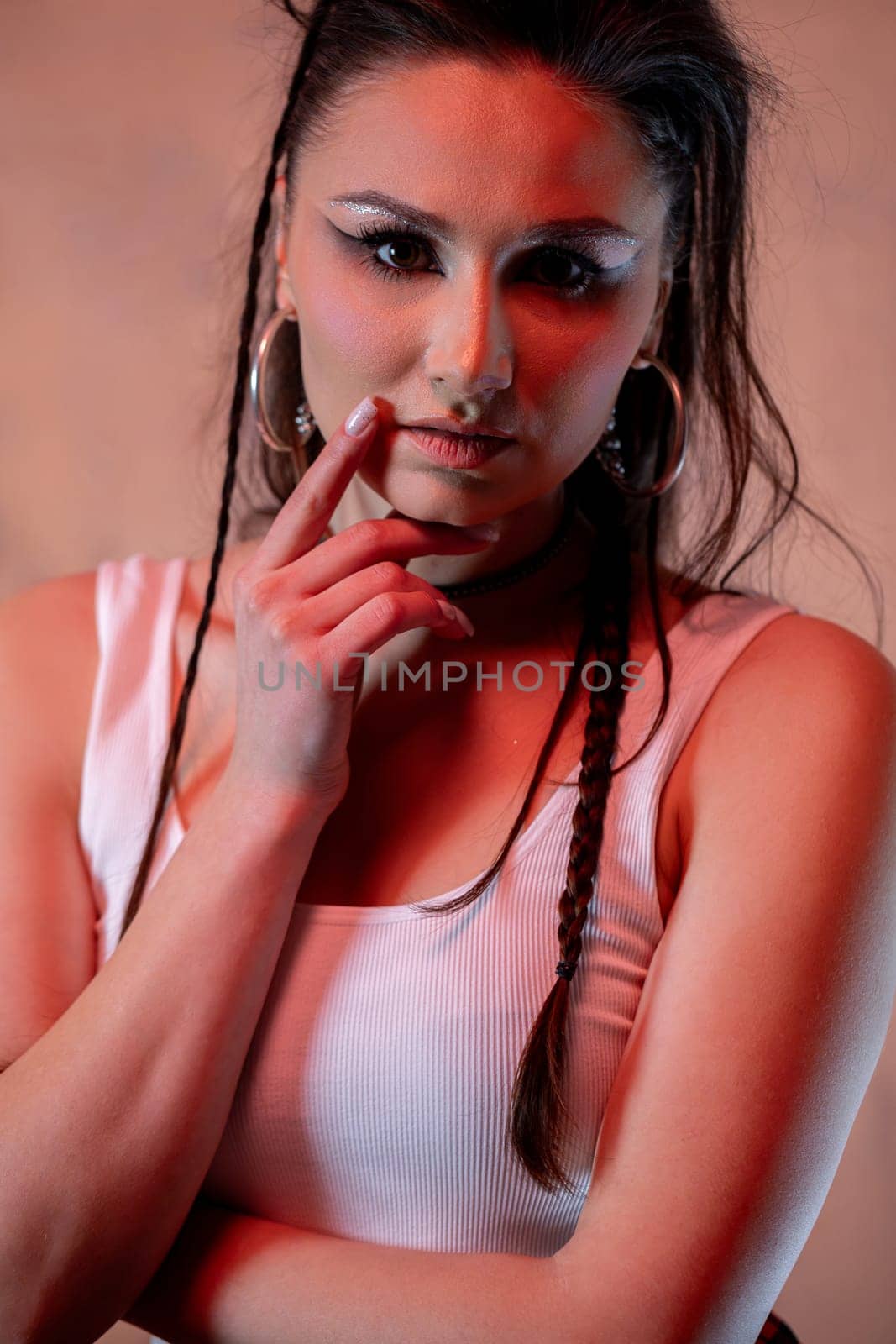 A striking portrait of a confident woman with beautifully braided hair and a stylish outfit that stands out