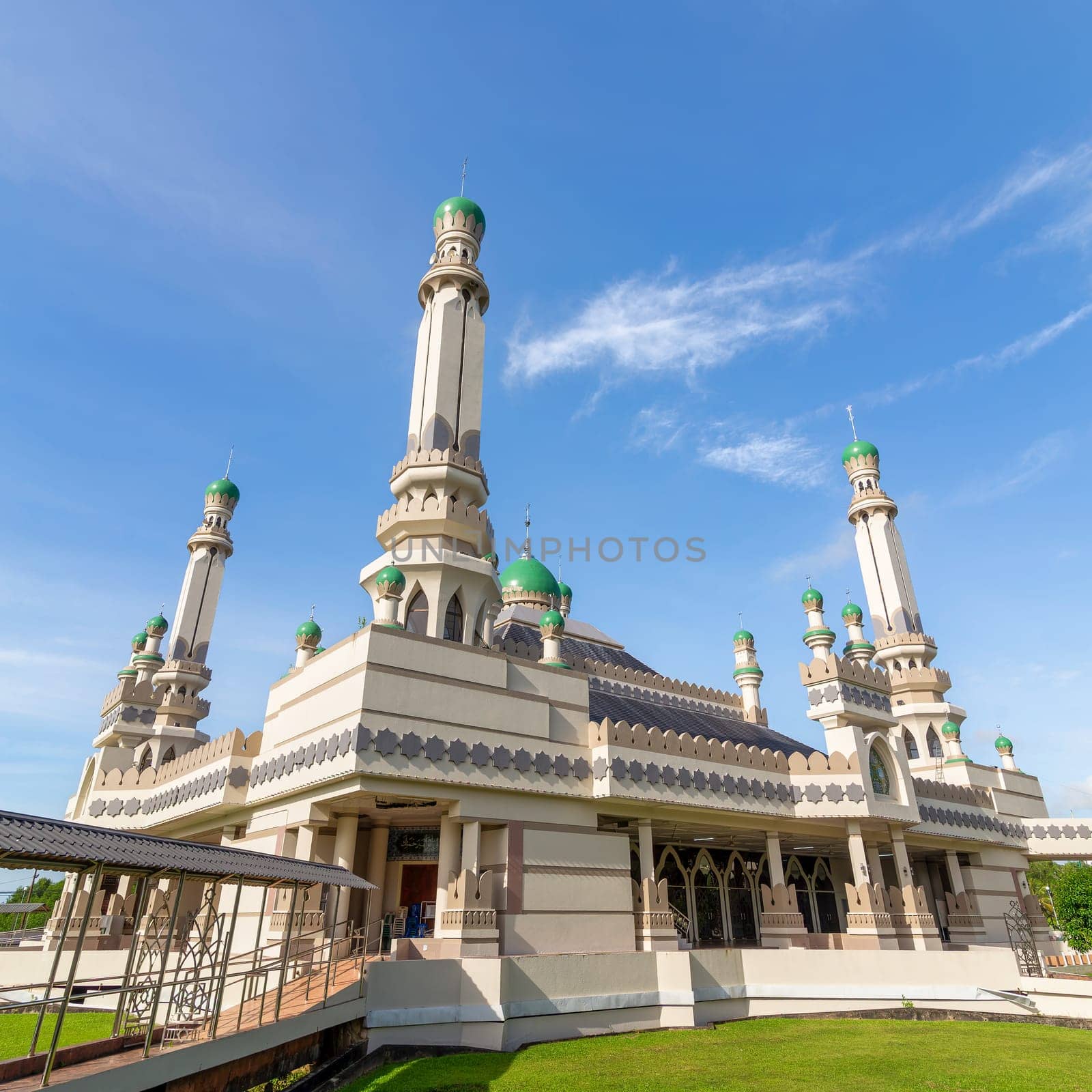 Masjid Duli Pengiran Muda Haji Al-Muhtadee Billah Mosque, stands majestically in Bandar Seri Begawan, Brunei Darussalam, showcasing intricate designs and vibrant domes under a clear blue sky