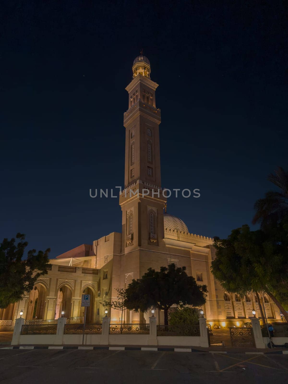UAE, Dubai, 23 September 2024: Illuminated Jumeirah mosque Masjid Rawda Al Abrar Mosque at dusk, It is also an educational center for cultural understanding. Muslim religion concept. High quality photo