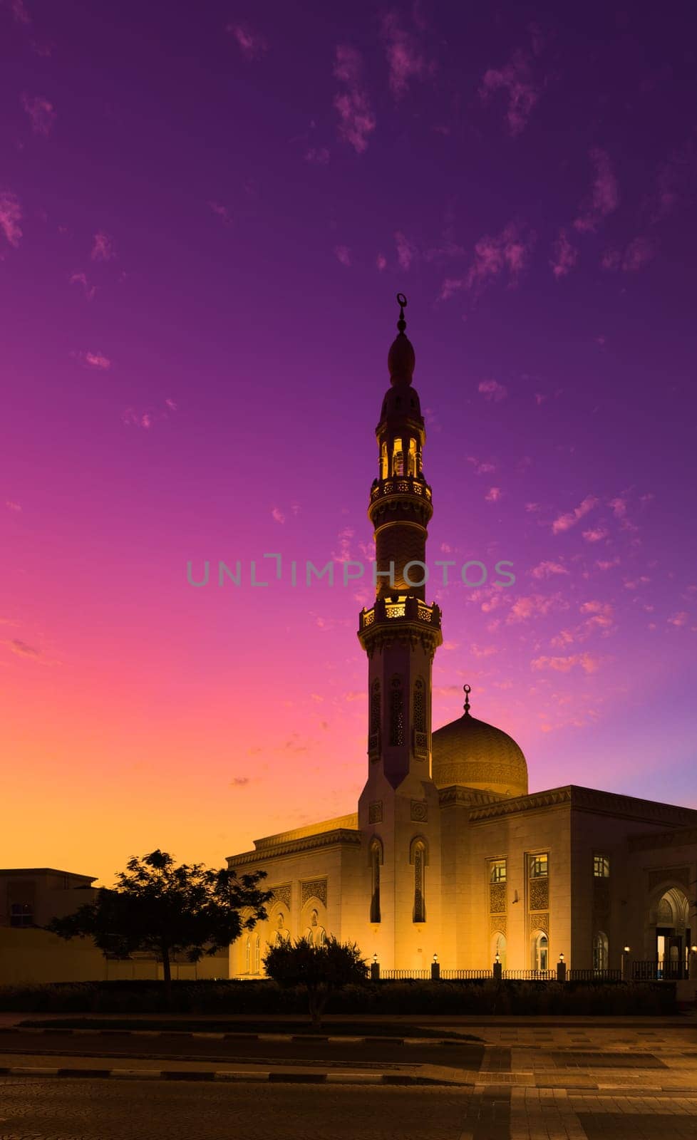 UAE, Dubai, 23 September 2024: Illuminated Jumeirah mosque Masjid Rawda Al Abrar Mosque at dusk, It is also an educational center for cultural understanding. Muslim religion concept. High quality photo