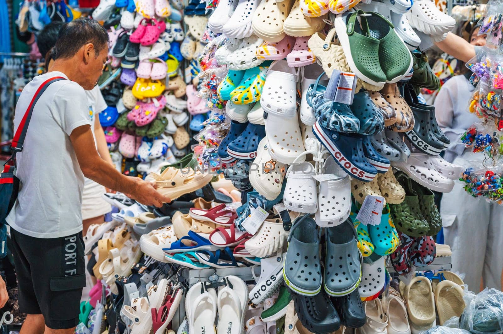 Clogs and other Crocs products are for sale in a shoe store. Nha Trang, Vietnam - December 13, 2024.