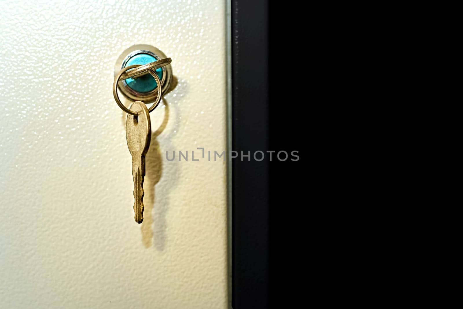 a small piece of shaped metal with incisions cut to fit the wards of a particular lock