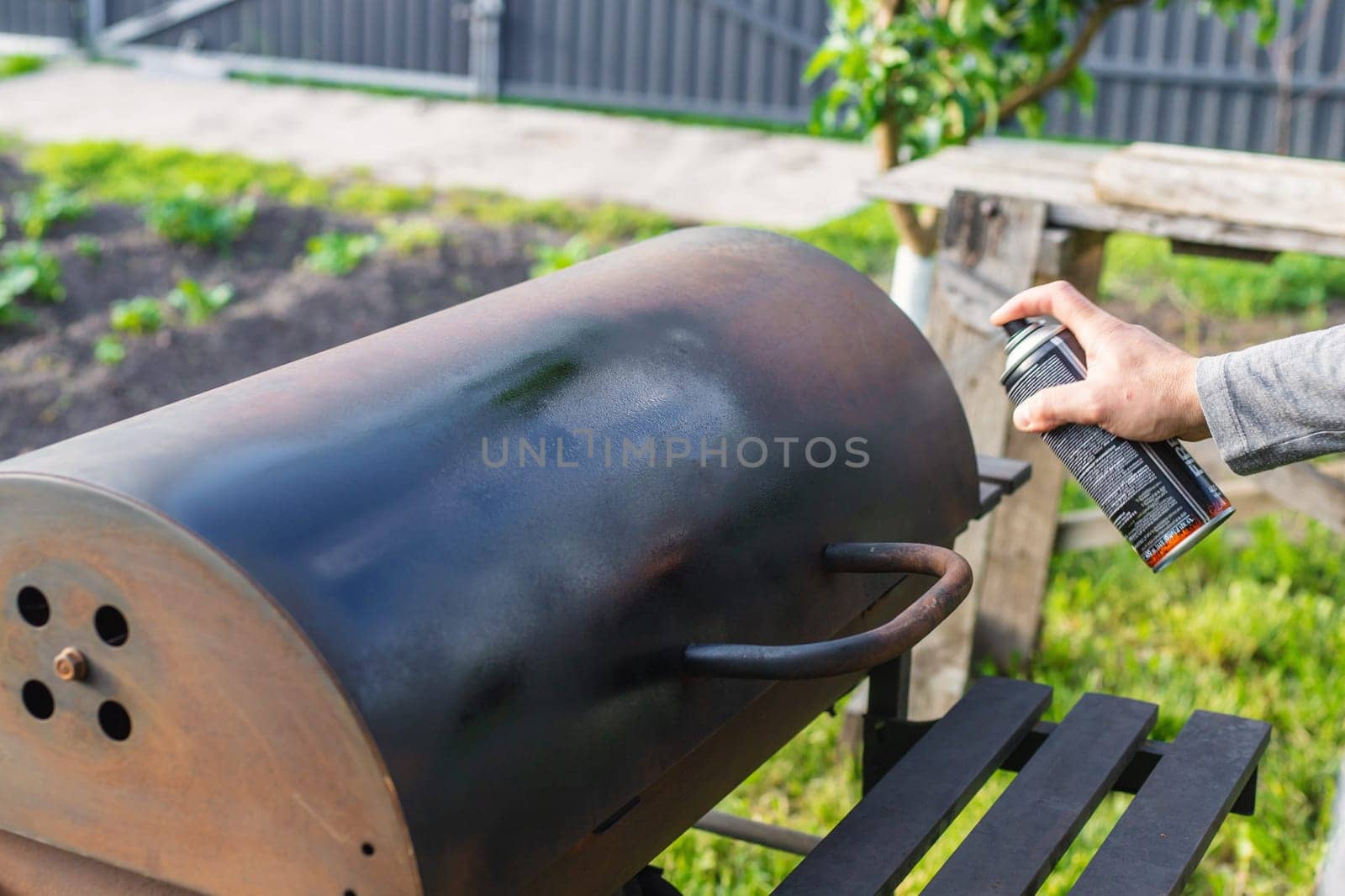 Man painting with spray paint. Selective focus. people.