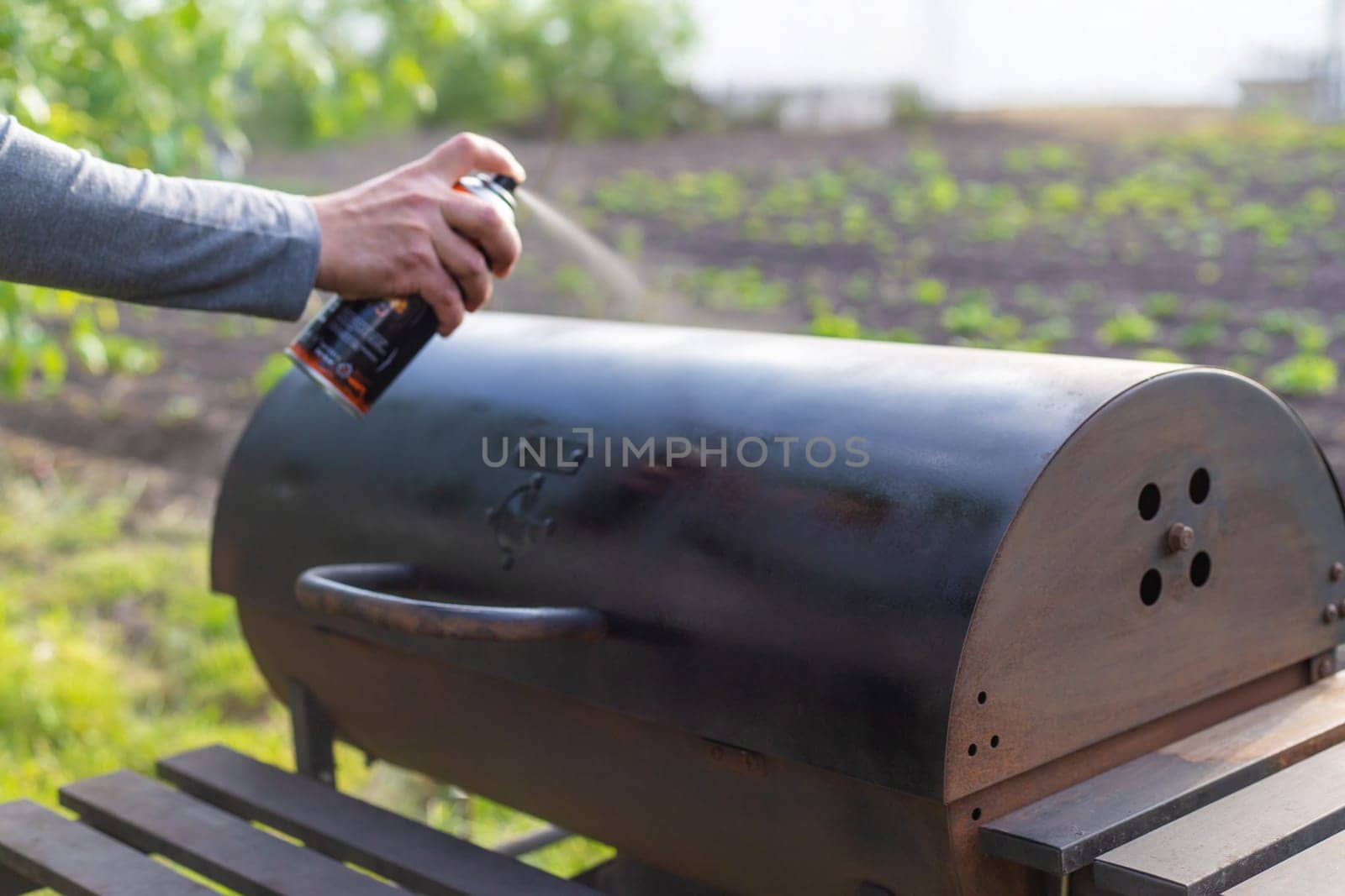 Man painting with spray paint. Selective focus. people.
