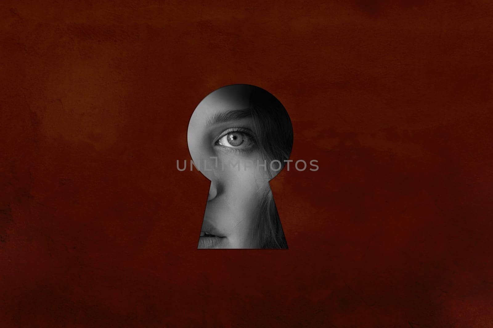 A keyhole reveals a woman's eye, showcasing intrigue and mystery. The textured brown background enhances the emotional depth and curiosity in the scene.