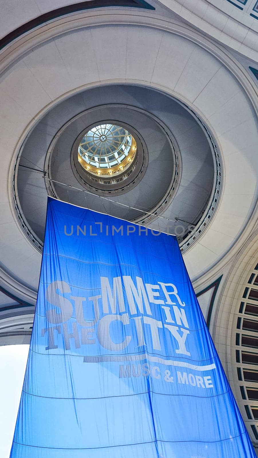 Boston, MA USA - 08.04.2024: Architectural Marvel Upward View of a Building s Interior with Summer Event Banner.