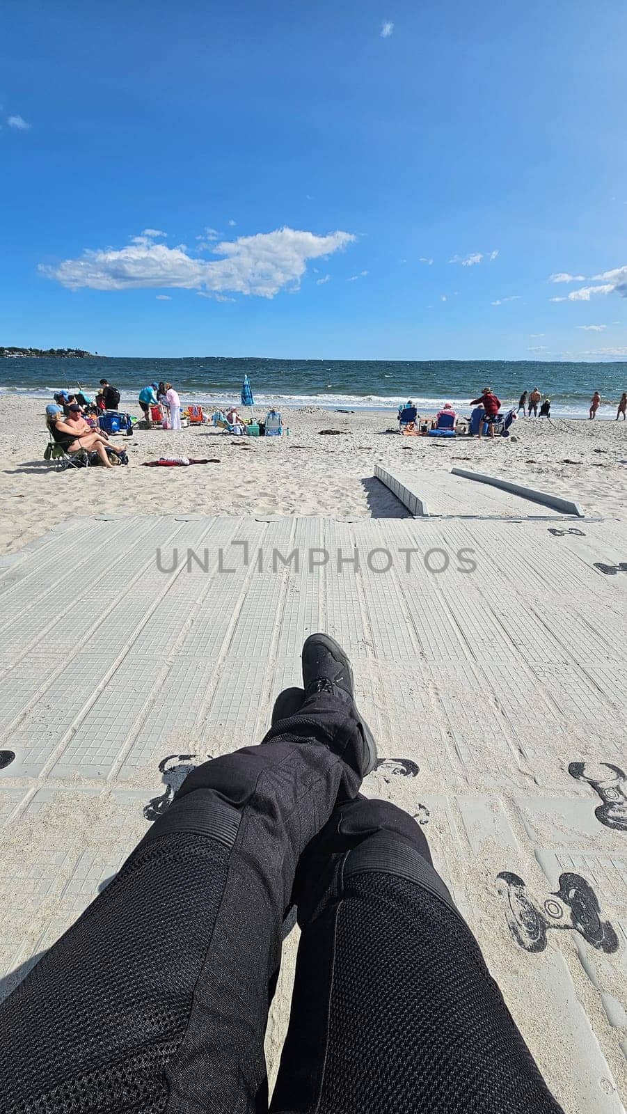 Sargents Purchase, NH USA - 08.22.2024: Relaxing Beach Scenery Motorcyclist s Perspective on a Sunny Day with Blue Skies and Ocean View.